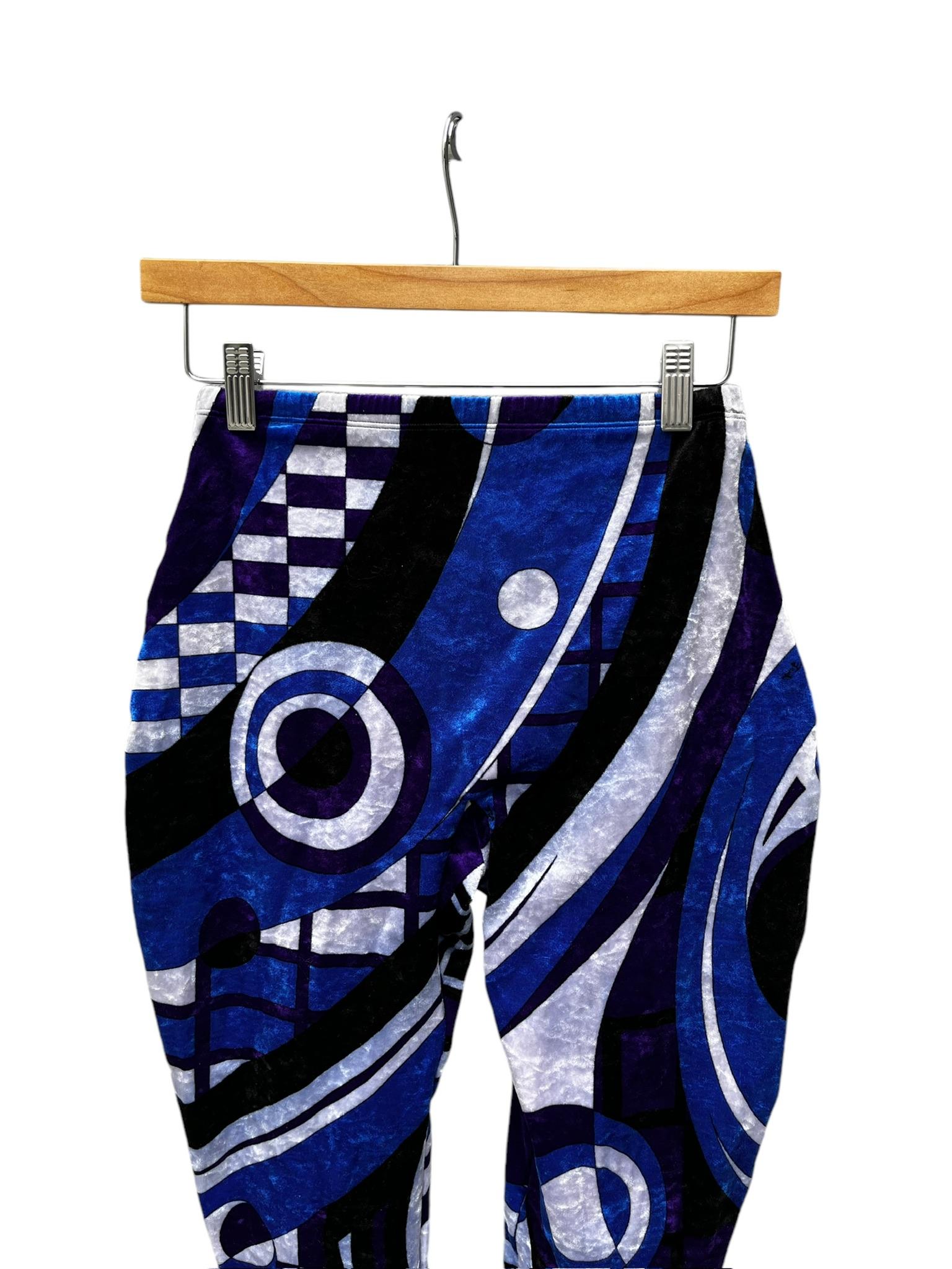 Rare vintage Emilio Pucci crushed velvet stirrup leggings. A very cool and unique print in a classic Pucci color palette of blues, ice grey, black and purple. Leggings have stretch and an elastic waist. Center back zipper plus hook & eye. The