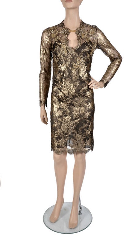 EMILIO PUCCI DRESS
Gold lace with black silk chiffon slip on.
Beads, sequins and crystals on the top.
Metal clasp with Pucci engraving.
Long sleeves with zippers.
