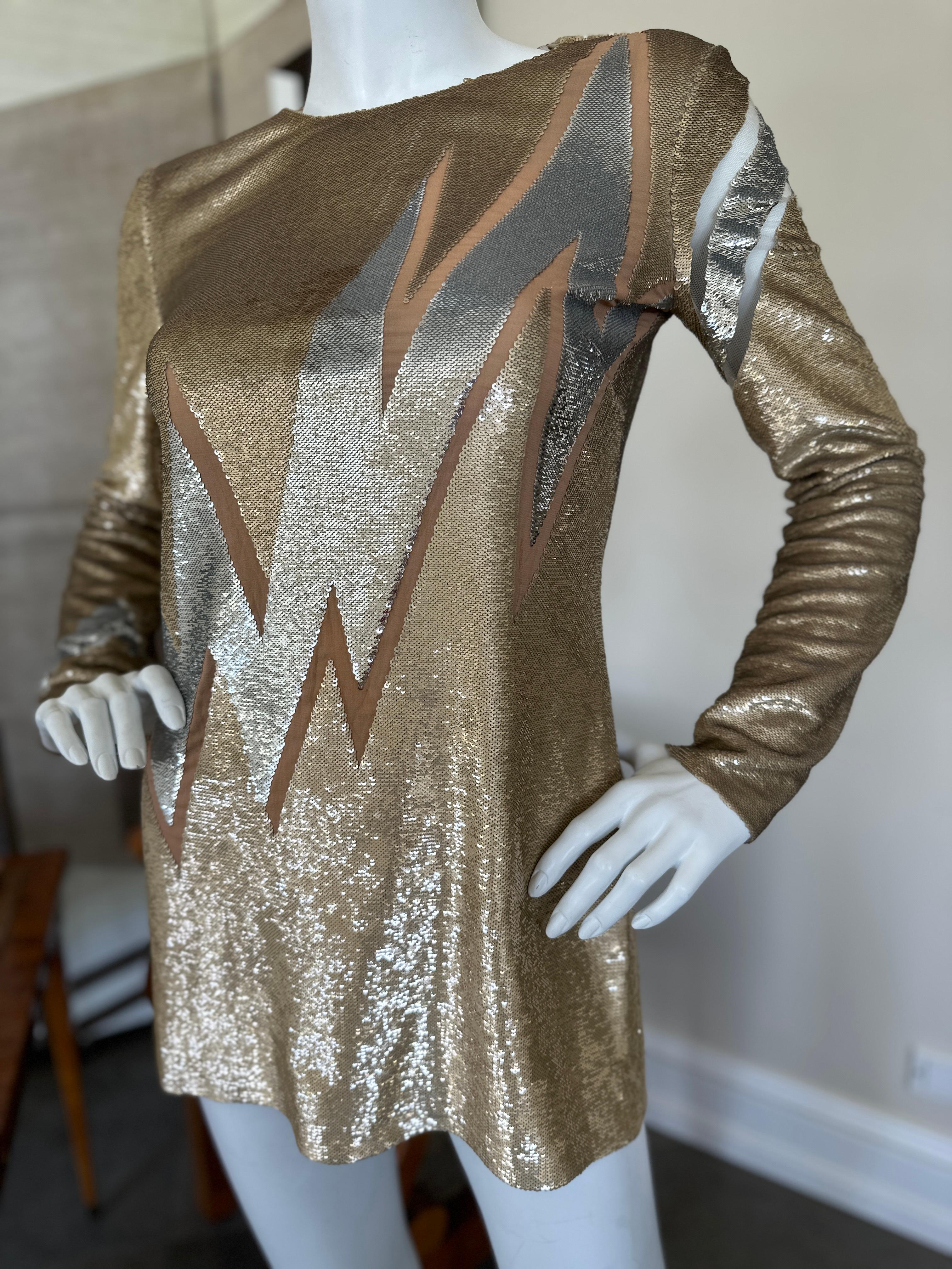 Emilio Pucci Current Season Gold Sequin Lightning Bolt Mini Dress.
This is so cute, and is currently in Neimans for $2500
Size 4
Bust 42