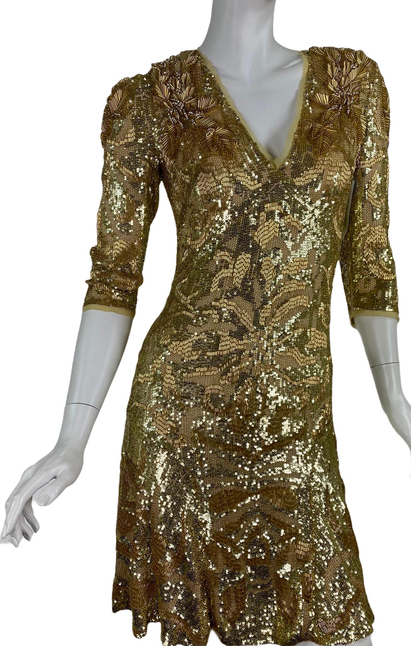 EMILIO PUCCI Embellished dress in Gold

Sequins beads and crystal 
V-neck 
3/4 sleeves
Content: 92% silk, 8% elastane

IT Size: 40 - US 4
Armpit to armpit: up to 18