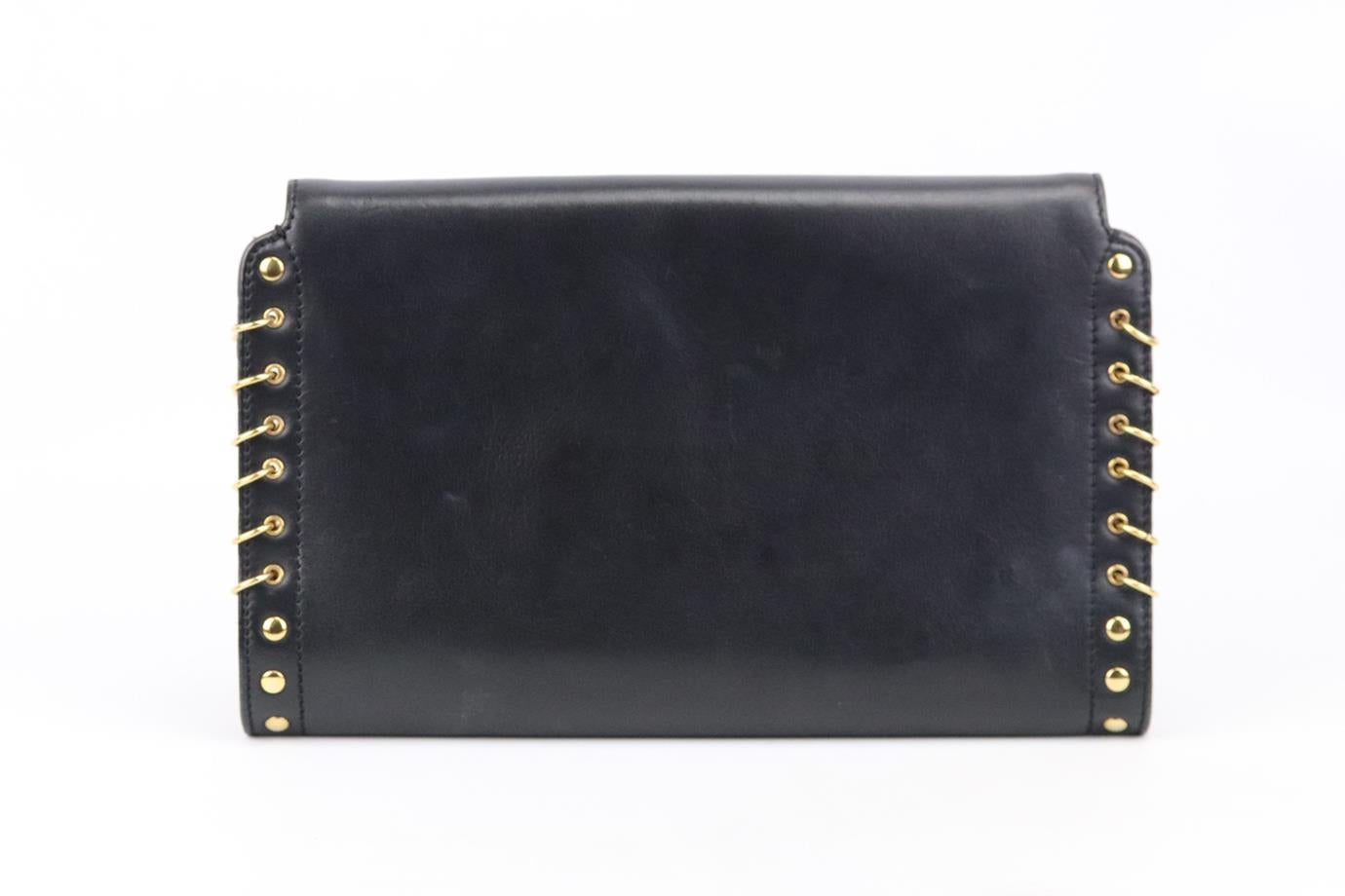 This shoulder bag by Emilio Pucci can be worn cross-body, over the shoulder or as a clutch thanks to the detachable chain strap, it's crafted from smooth black leather in a slim shape and has embellishment detail down the sides. Black leather. Twist