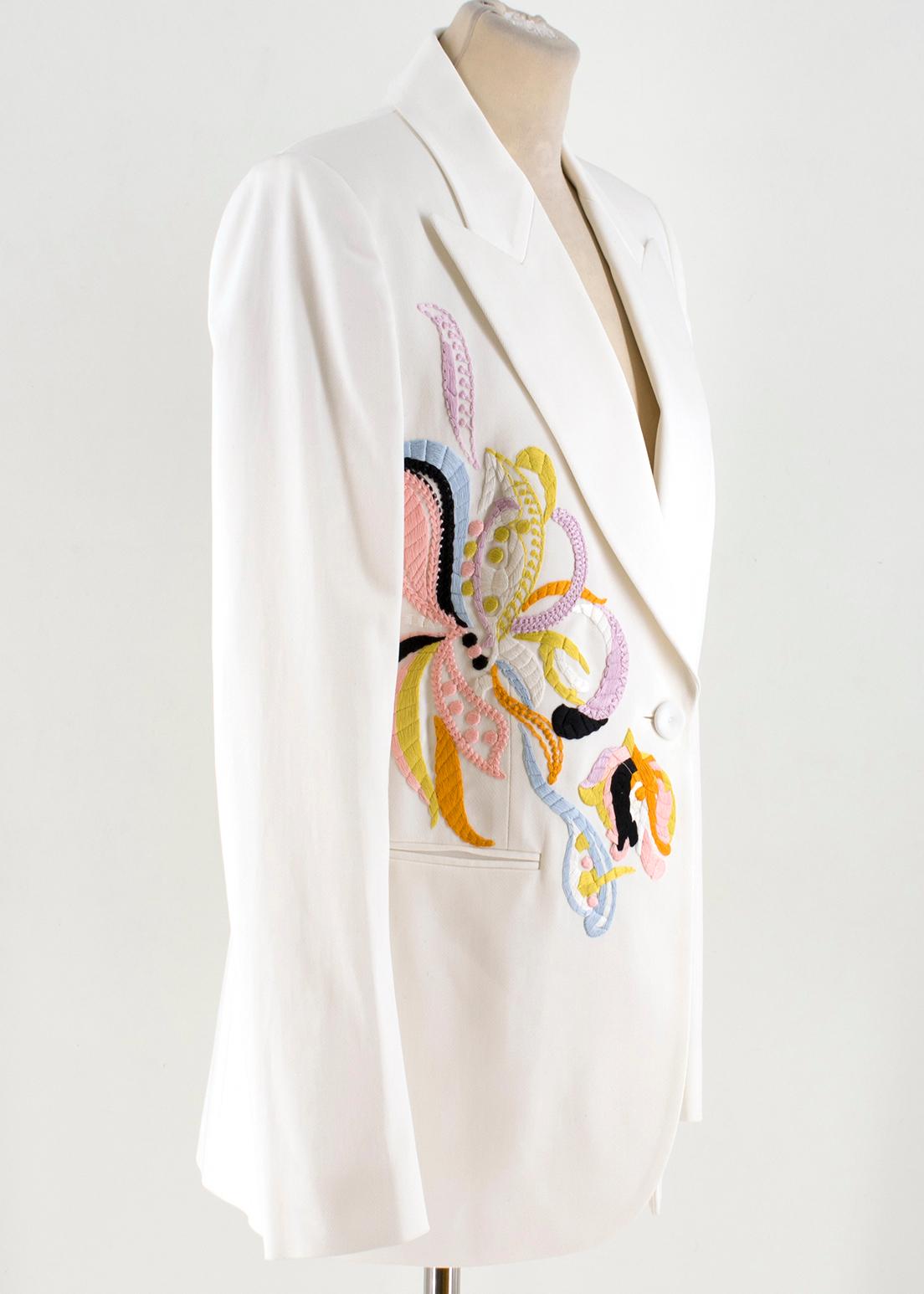 Emilio Pucci embroidered white twill blazer

- White, structured twill 
- Peak lapels, long sleeves, padded shoulders 
- Multicoloured floral hand embroidered front and back feature
- Jet pockets 
- Single breasted, one button fastening
- White