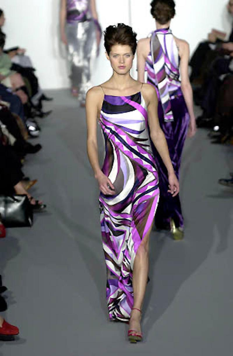 Dating to the F/W 2000 collection, this stunning Emilio Pucci dress appeared on the runway that season. Made in Italy from silk satin in a gorgeous violet, lilac, grey & white print, this features a boat neck, spaghetti straps and dramatic side