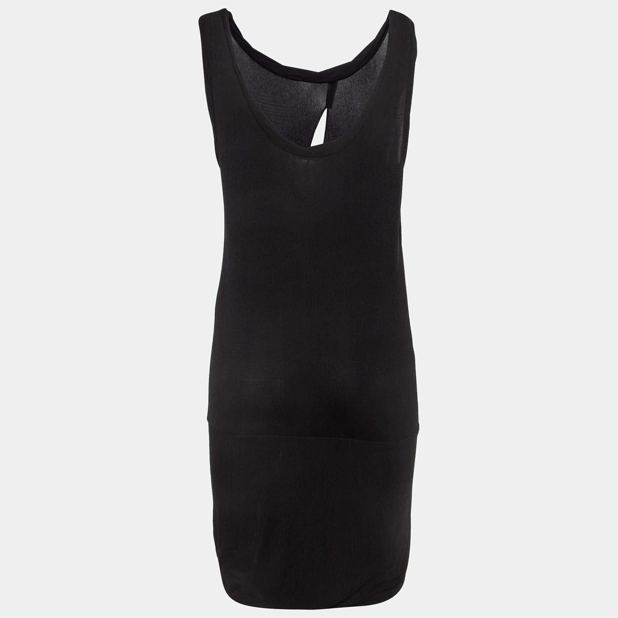 This Emilio Pucci dress is a chic and stylish garment that exudes elegance and sophistication. With its sleek design flattering silhouette and high quality craftsmanship this dress is perfect for any special occasion or evening event ensuring you