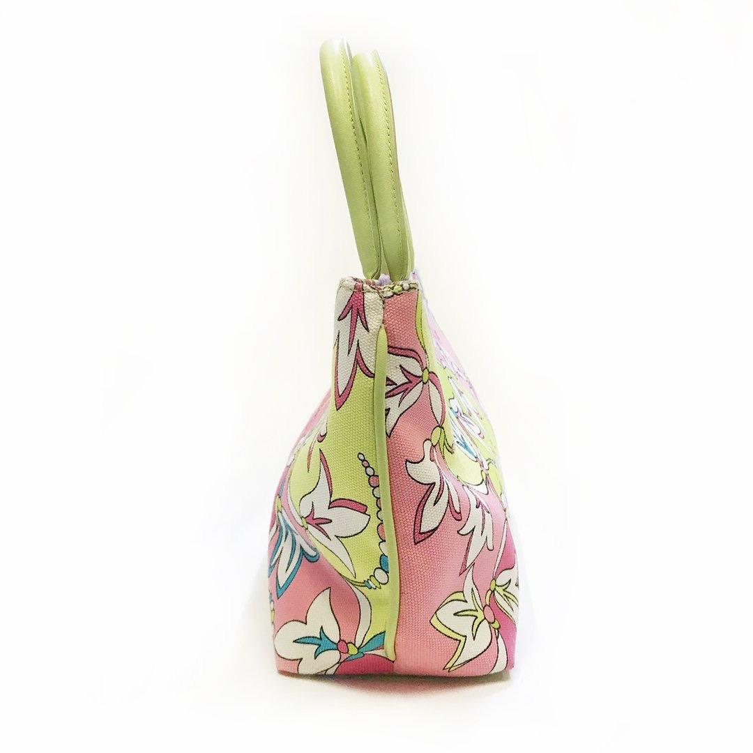 Floral mini tote by Emilio Pucci 
Pink and green multicolor printed canvas
Signature Pucci floral print
Lime green dual rolled leather top handles
Lime green leather trim
Single snap closure 
Silver-tone hardware
Single zip pocket on interior
Made