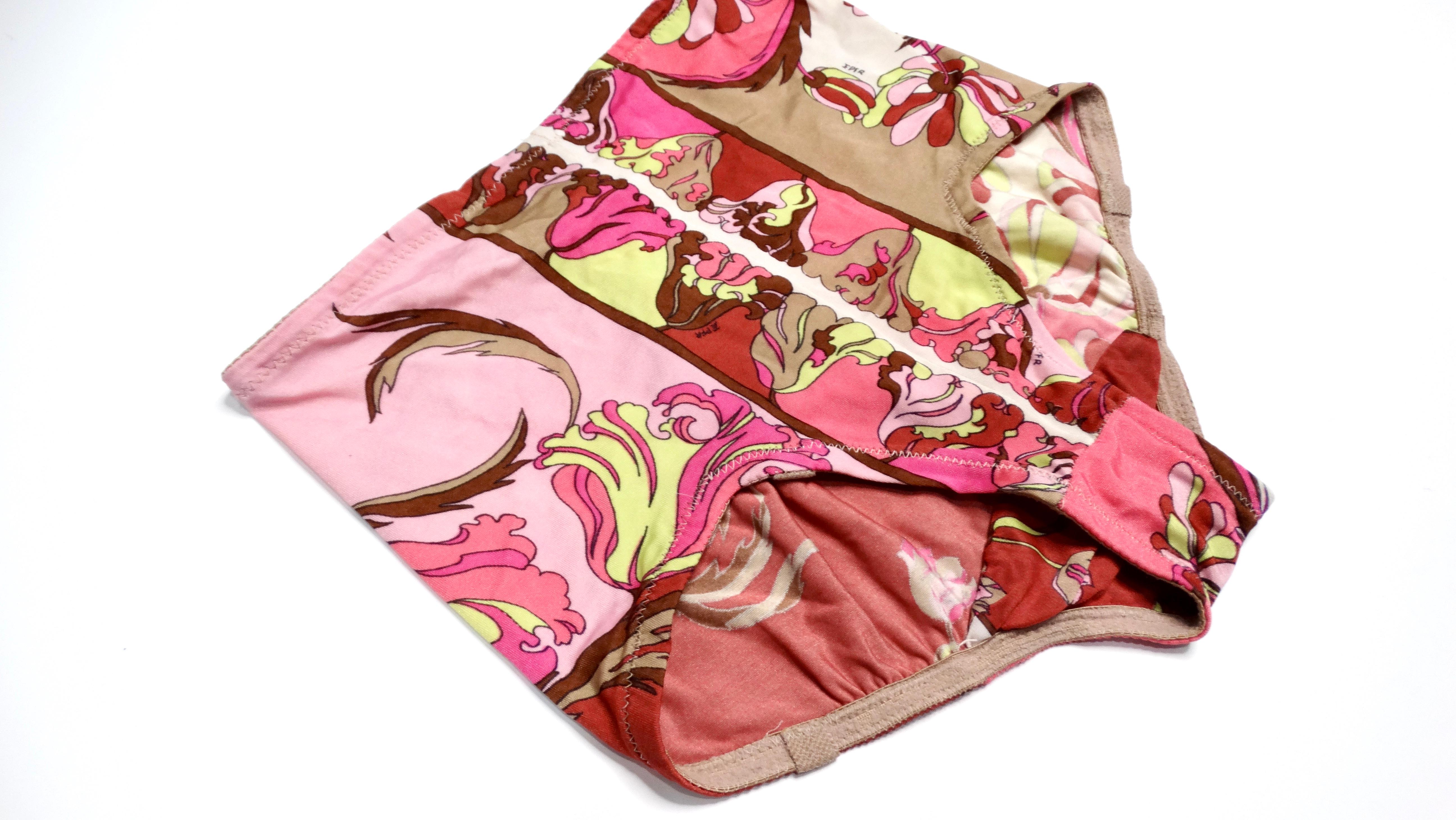 Emilio Pucci's Formfit 1960s Retro Floral Swim Bottoms epitomize the essence of vintage chic with their enchanting classic Pucci print, featuring a delightful retro pink floral design. Crafted from a blend of nylon and spandex, these high-waisted