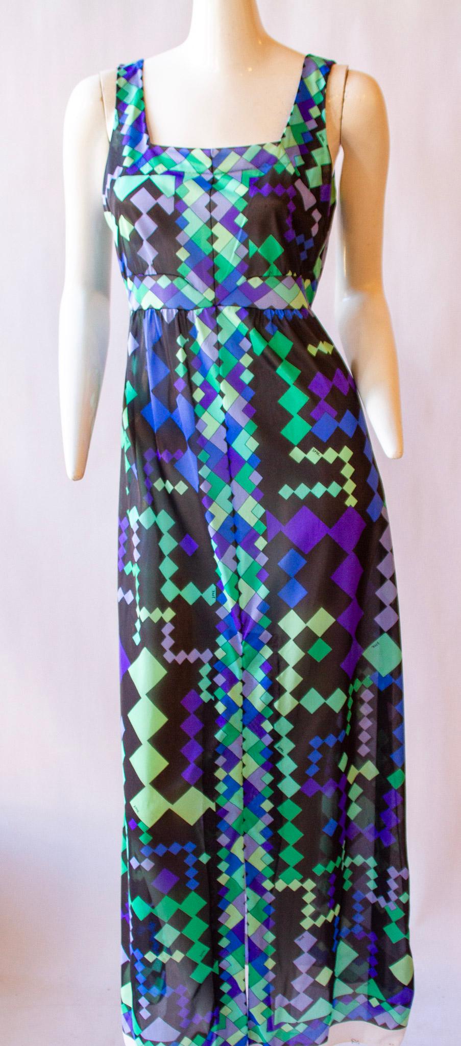 EMILIO PUCCI for Formfit Rogers, Two-Piece Silk Ensemble, Long Green and Purple Diamond Print Sleeveless Dress with Square Neck and Long Matching Shell with Front Buttons and Ruffle Collar, circa 1959-1960

This is a gorgeous silk ensemble. Soft to