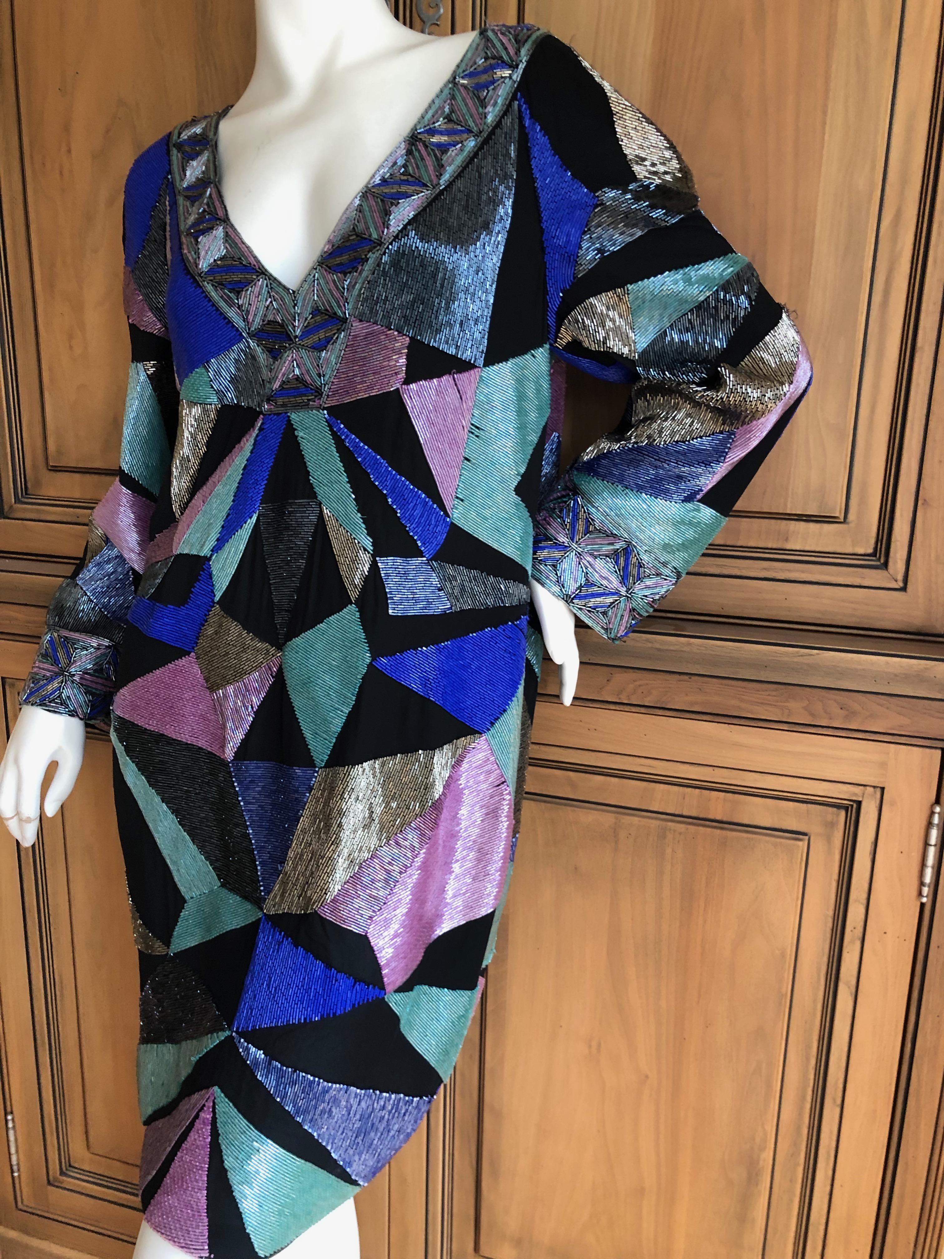 
Emilio Pucci Rare Embellished Cocktail Dress .
This still has the store tags attached, the retail was $7260 USD
WOW 
Rare to see a completely embellished Pucci before, this is unreal.
The beads are glass, and this is quite heavy.
Size 42
Bust  38