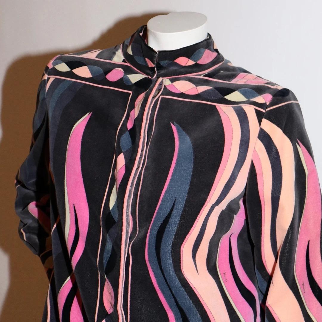 Emilio Pucci Housecoat 
Vintage 
Circa 1968 -1970 
Made in Italy 
Velvet 
Pink, peach, black and grey tones 
Classic Pucci psychedelic print
Mandarin style collar 
Three hook and eye closures at neckline 
Blouson style sleeves 
Buttons down front of