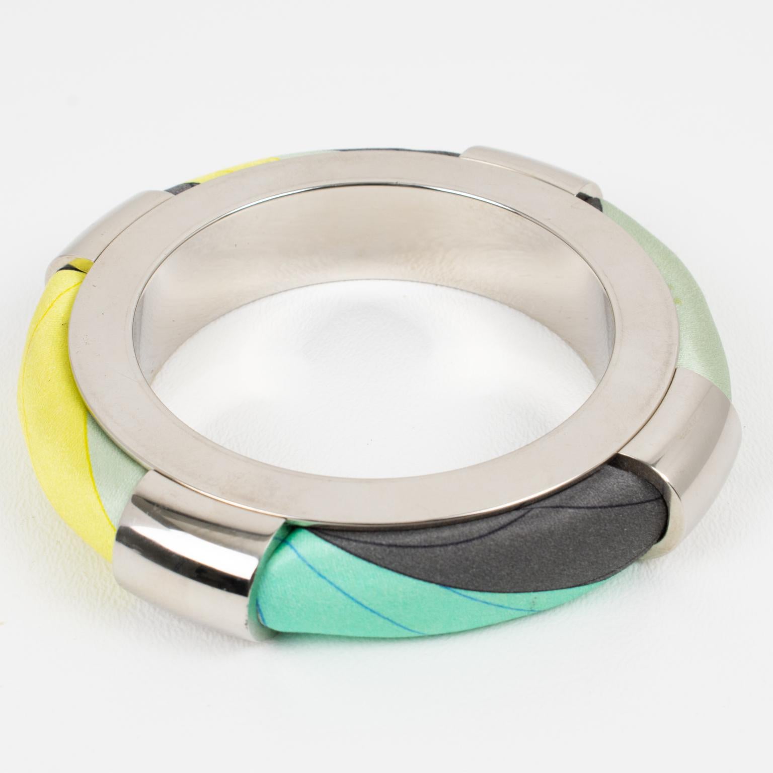 Emilio Pucci, Italy, designed this stunning chunky silvered metal and silk bracelet bangle. The abstract design features a massive silvered metal framing with multicolor silk elements. Emilio Pucci's signature silk abstract fabric is encased into