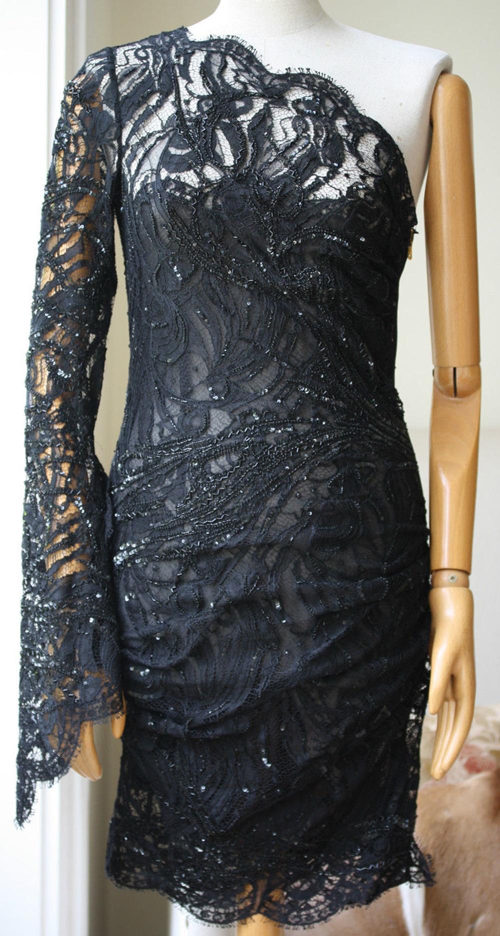 Make a statement at your next event in Emilio Pucci's one-shoulder black lace dress. This curve-skimming design has a long draping sleeve, flattering ruching along the body, delicate eyelash trims and exquisite sequin embellishment. 100% Silk