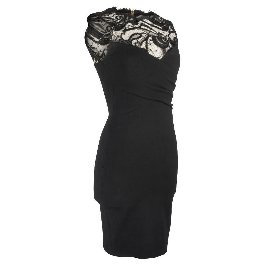 Mightychic offers an Emilio Pucci black sleeveless dress with beautiful lace inset. 
Bodice has figure enhancing criss cross panels.
Bold rear zip in gold with embossed pull.
The perfect LBD from dinner to cocktail party.
Fabric is viscose, nylon