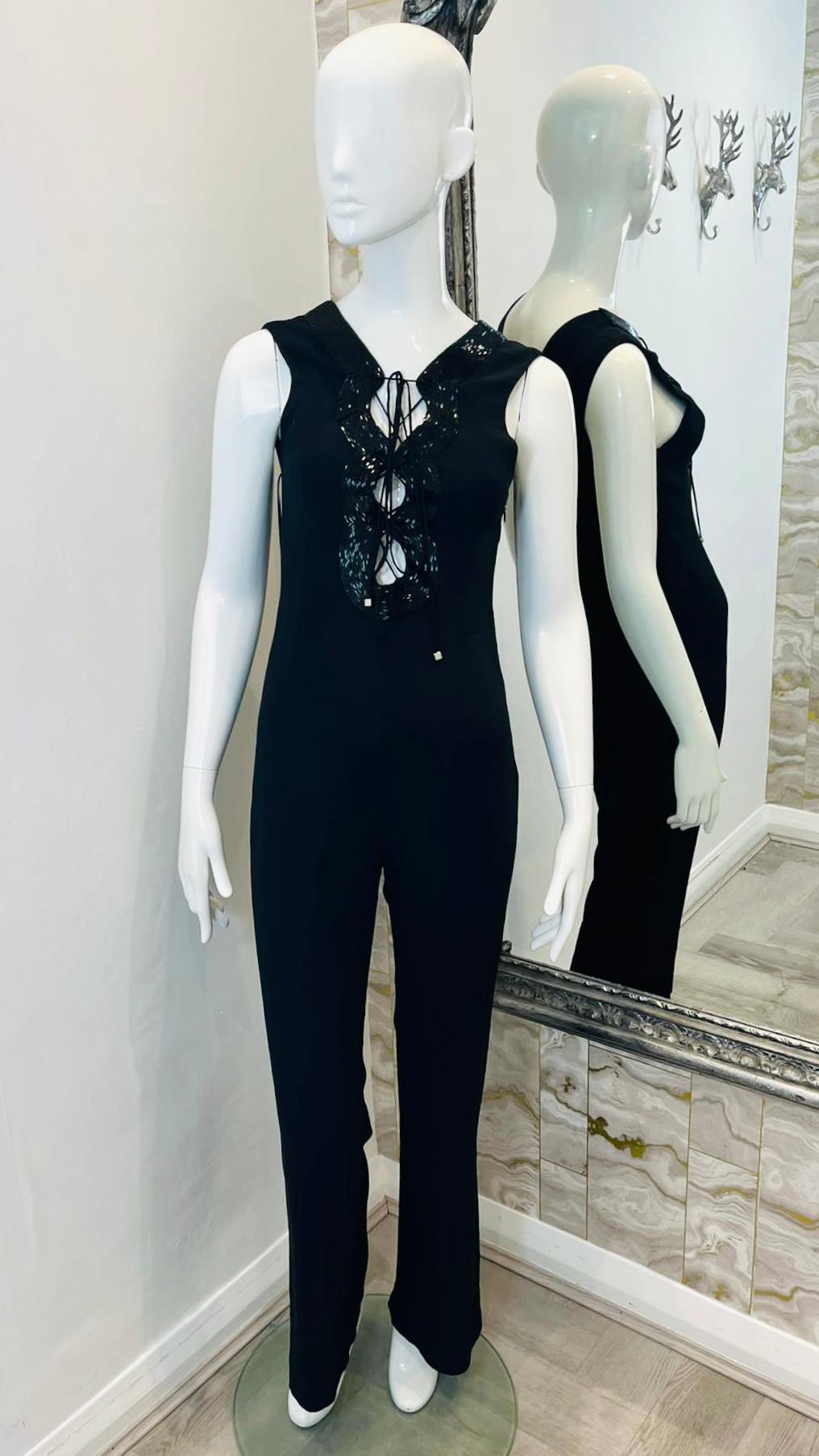 Emilio Pucci Lace-Up Silk Blend Jumpsuit

Black,, sleeveless jumpsuit designed with lace-up detailing to the front trimmed with wide, black beaded strap.

Featuring slim fit silhouette, flared leg and deep V-neck to rear.

Size – 40IT

Condition –