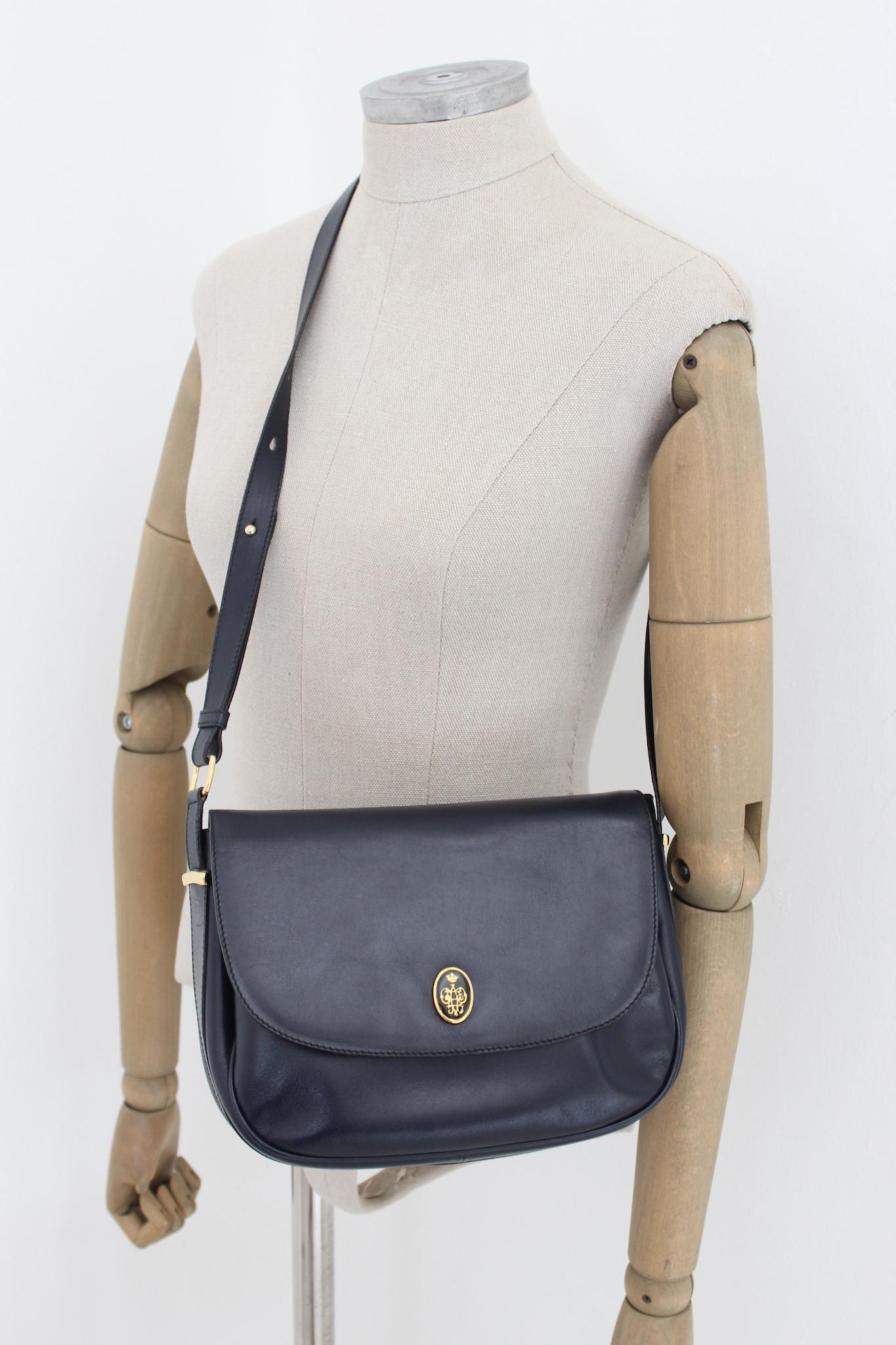 Emilio Pucci Leather Dark Blue Shoulder Bag Vintage 1980s. Beautiful half moon shape, very soft calfskin fabric. Dark blue color, adjustable shoulder strap with golden brass inserts. Inside there are two compartments and a smaller one with a zip.