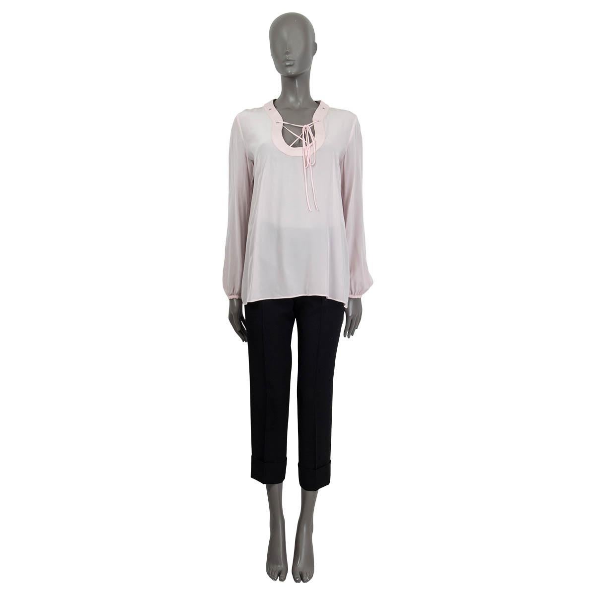100% authentic Emilio Pucci lace-up blouse in light pink silk (100% please note the content tag is missing). Features a leather collar and buttoned sleeves. Unlined. Has a barely visible yellow stain at the front, otherwise in excellent