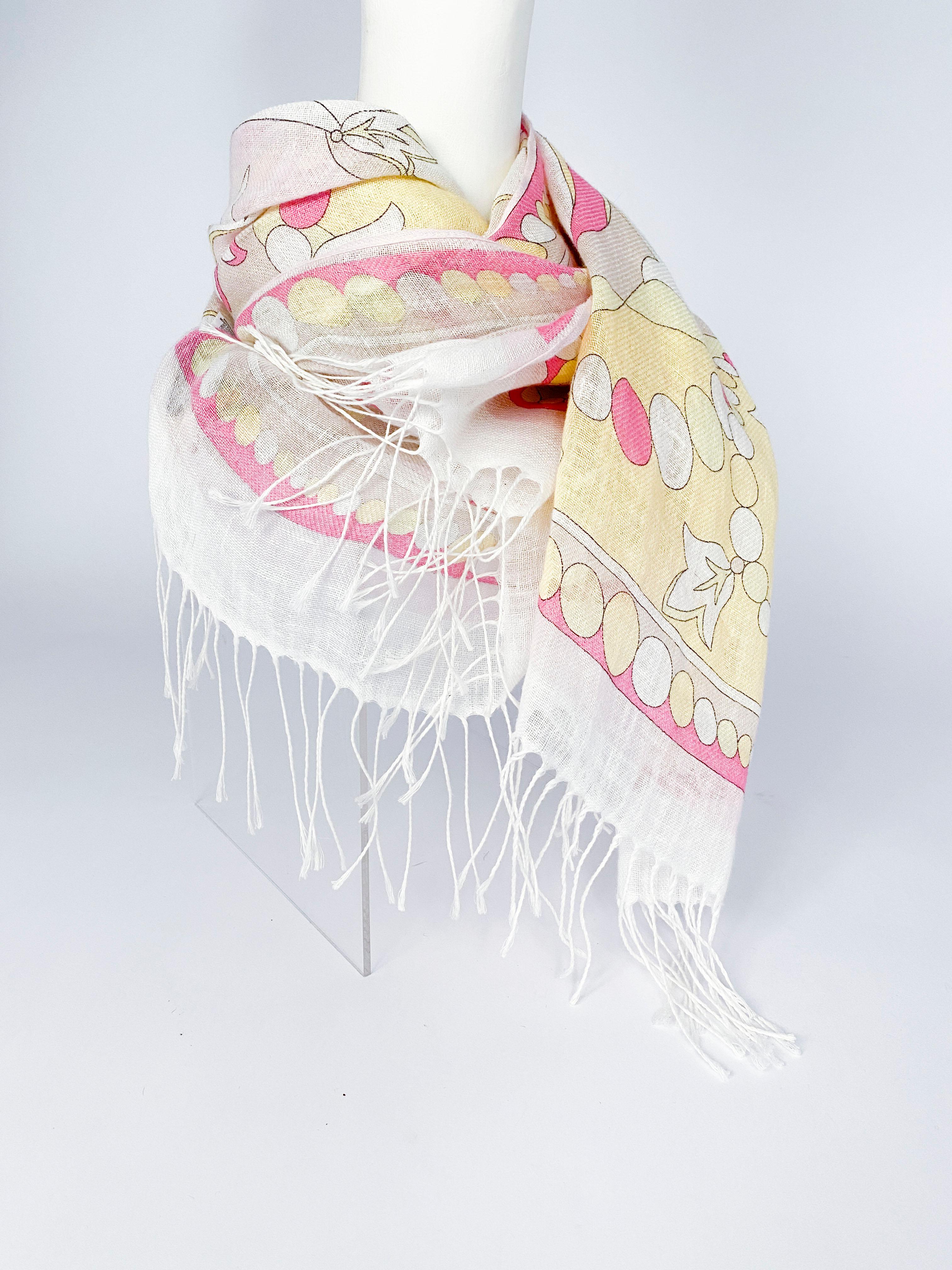 Emilio Pucci linen scarf featuring an abstract printed motif with tones of green, pink, beige, green, and yellow. The ends are finished with fringe.