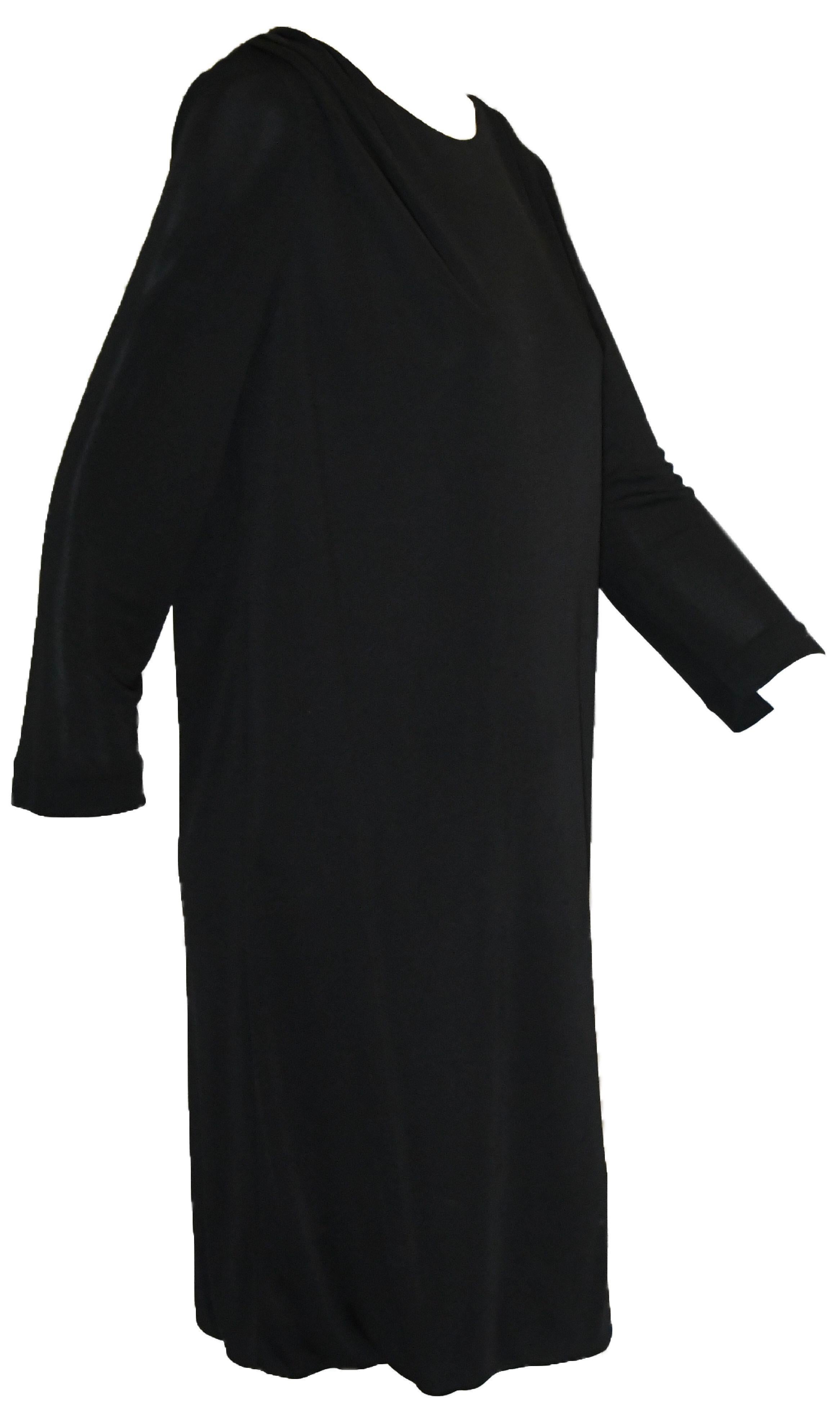 Emilio Pucci's Little Black Dress features exquisite 100% Viscose fabric.  Features 3/4 sleeves and gathered shoulders defined by small pleats.  This comfortable, easy-to-wear dress is the perfect traveling companion. and a must-have for any
