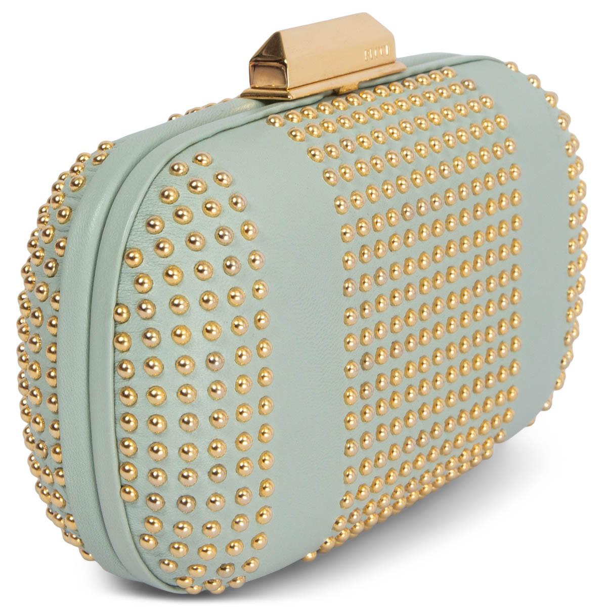 100% authentic Emilio Pucci box clutch in pale mint calfskin featuring gold-tone studs and frame closure. Lined in a classic Emilio Pucci fabric in pale lilac, blue and turquoise silk fabric. Has been carried and is in excellent condition.