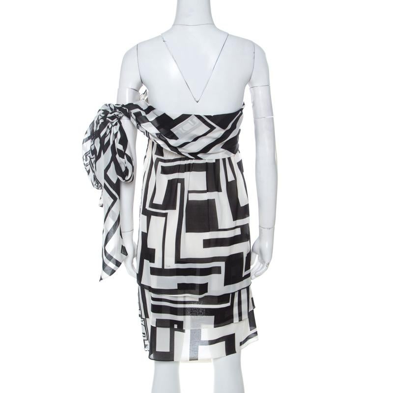 We are singing praises for this cotton dress from Emilio Pucci as it is well-made and beautiful to look at. It arrives in monochrome patterns and designed with a tie detail. Be sure to try it with pumps and a top handle bag.

