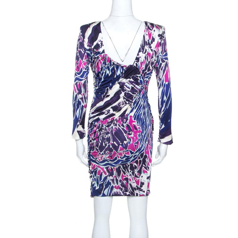 Leave everyone in awe whenever you step out in this gorgeous dress by Emilio Pucci! Made from 100% silk, the dress has a flattering silhouette with very elegant ruched details and abstract prints. You can assemble the complete look with a pair of
