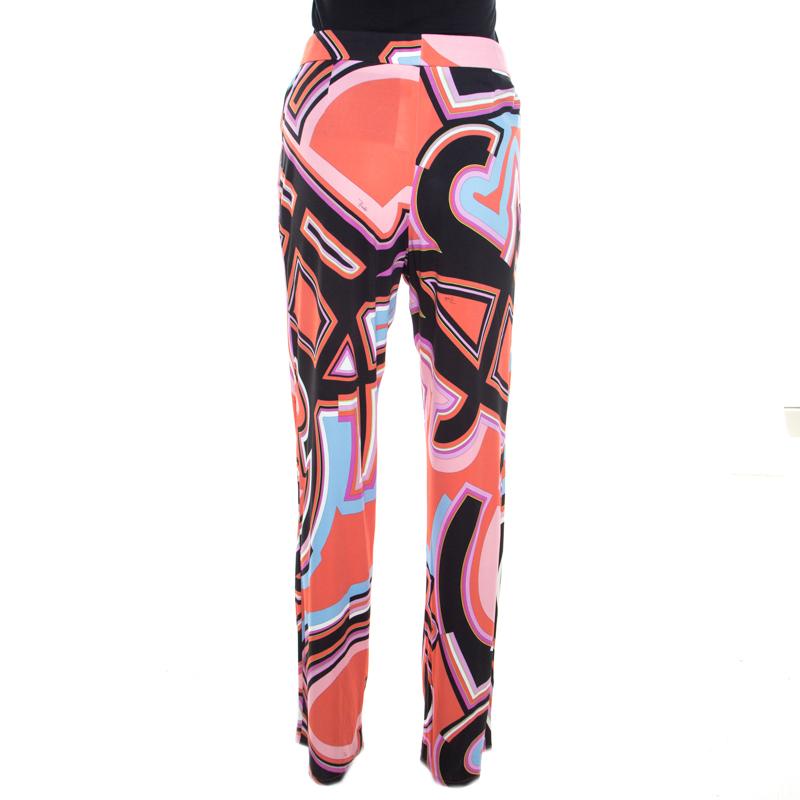Those fun outings with friends call for everything playful and vibrant just like these lovely trousers from Emilio Pucci. These trousers feature a multicolour monogram print all over. They flaunt a relaxed silhouette and can be paired well with