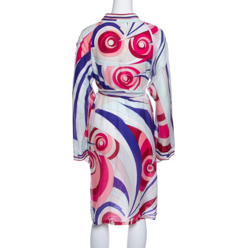This multicoloured printed tunic dress from the house of Emilio Pucci is a gorgeous piece for your upcoming events. It is designed with long sleeves, a plunging neckline, and a self-tie waist belt. Crafted with a silk-cotton blend, the outfit will