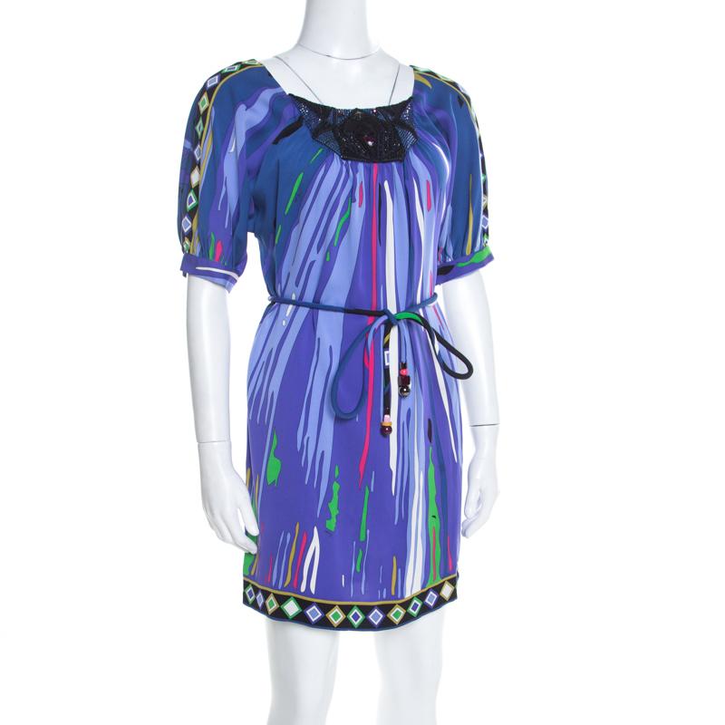 The crowds won't be able to take their eyes off you when you step out in this gorgeous dress from Emilio Pucci. The multicolored creation is made of a silk blend and features an exquisite print all over. It flaunts an embellished neckline, short