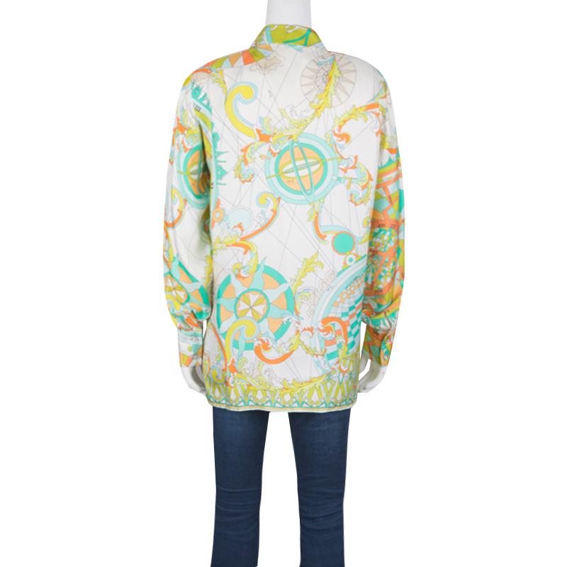 Emilio Pucci brings to you a simple silhouette in a quirky new avatar. This psychedelically printed blouse with a front closure detail is perfectly designed to meet your fashion needs. Let the soft silk fabric of this long sleeves blouse keep you