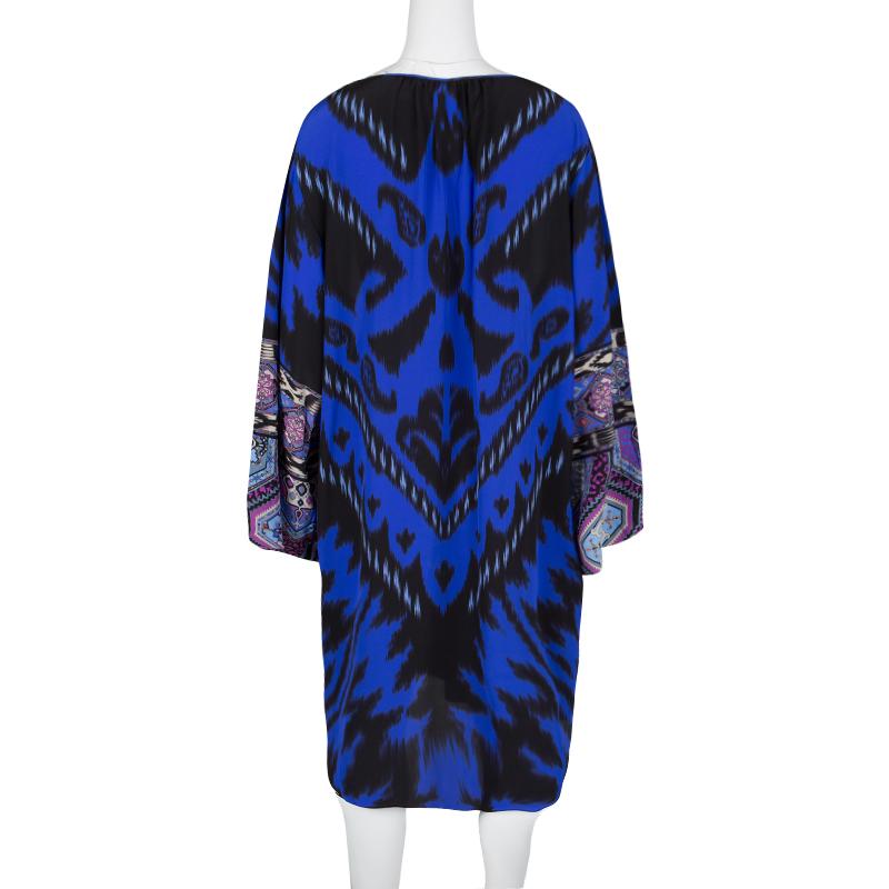 Designed in the most interesting multicoloured printed silk fabric, this Emilio Pucci dress creates unique patterns and boho chic everyday style. Featuring a round neckline with a slit at the middle, this dress also features long sleeves and a