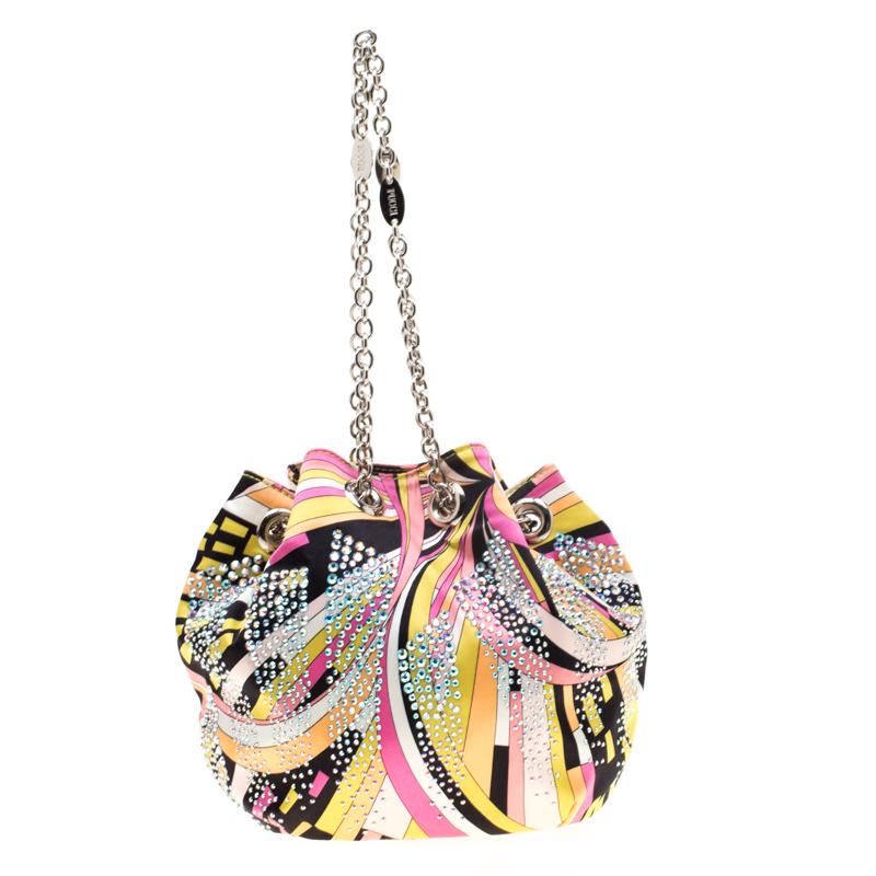 Be a trendsetter with this luxurious bag from the house of Emilio Pucci. Crafted with lush satin that imparts a soft feel, this chic bag is characterized by shiny crystal embellishments all over that gives a glamorous appearance. With an open to,