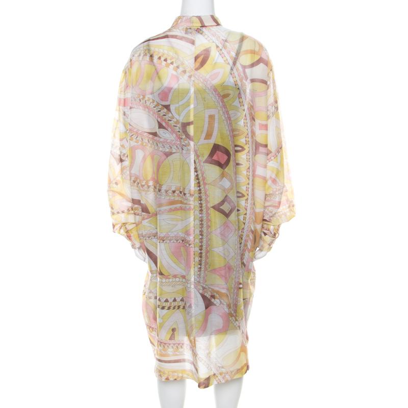 The multicolor printed shirt dress by Emilio Pucci is a must this summer. The trendy piece has a button closure and is skillfully tailored using cotton and silk. The dress can be worn over a plain sleeveless dress and strappy flats for a casual