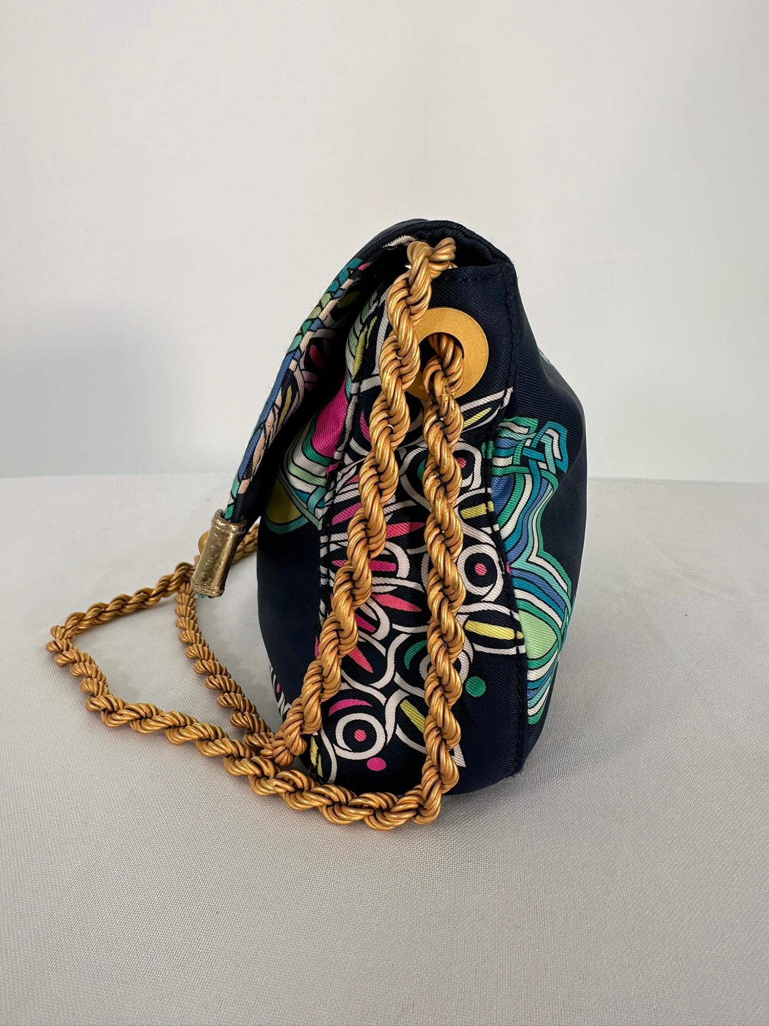 Emilio Pucci navy blue brightly printed flap front gold hardware hand bag matte gold chain strap. Navy blue nylon with a bright abstract print throughout. The flap front bag closes with a turnlock, gold hardware with a white acrylic diamond at the