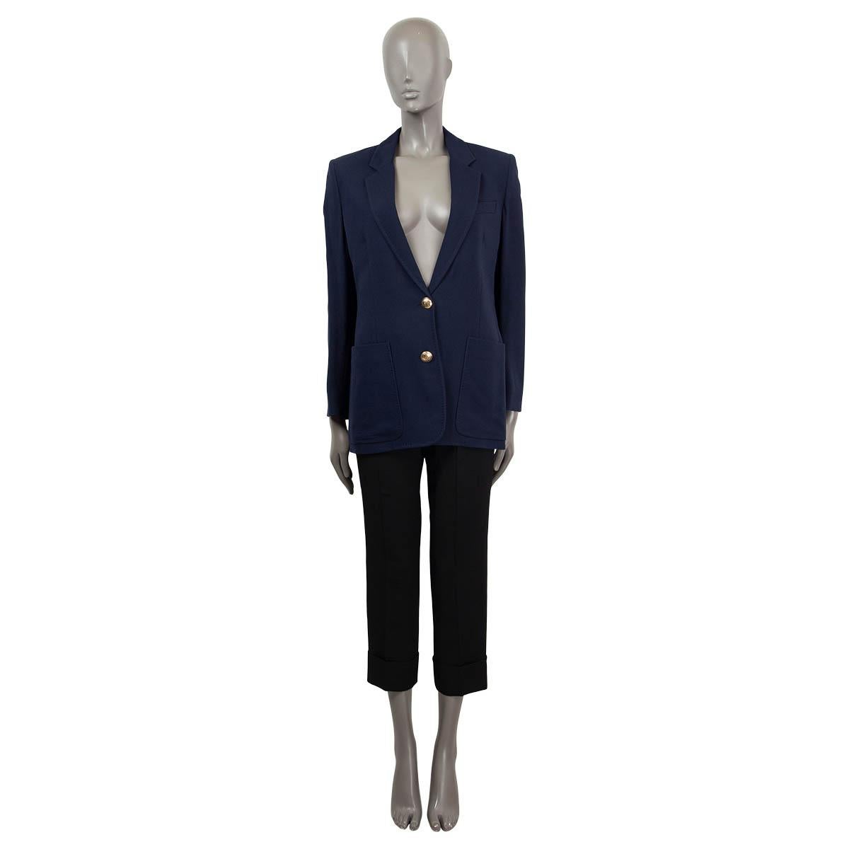 100% authentic Emilio Pucci blazer in navy blue viscose crepe (with 3% elastane). Features patch pockets and a peak lapel. Closes with two gold-tone buttons on the front and is partially lined in viscose (100%). Brand new - comes with spare