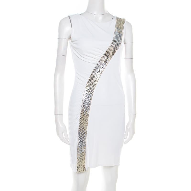 Complete a date-night look with this stunning Emilio Pucci dress. The sleeveless style is designed in white fabric and detailed with stunning sequin embellishment on it. It features a classic rounded neckline. Style with statement-making heels to