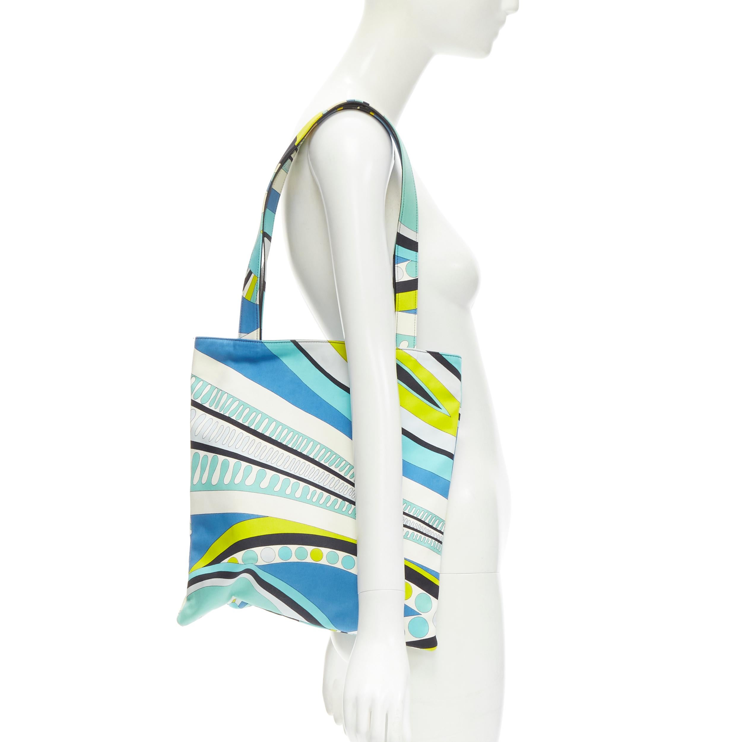EMILIO PUCCI Onde Nuages print blue yellow leather trim handle tote bag
Brand: Emilio Pucci
Material: Cotton
Color: Blue
Pattern: Abstract
Closure: Zip
Extra Detail: Leather trim on handle. Magnetic button at top. Zip wall pocket.
Made in: