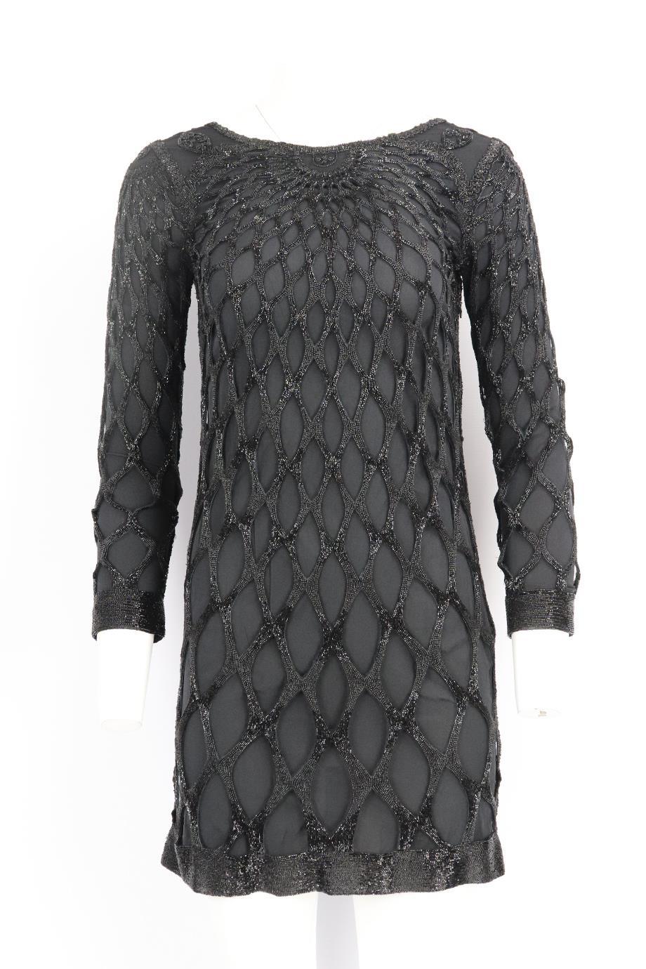 Emilio Pucci open back bead embellished silk mini dress. Black. Long sleeve, crewneck. Zip fastening at side. 100% Polyamide; lining: 91% silk, 9% elastane. Size: IT 40 (UK 8, US 4, FR 36). Bust: 33 in. Waist: 31 in. Hips: 36 in. Length: 33.5 in.