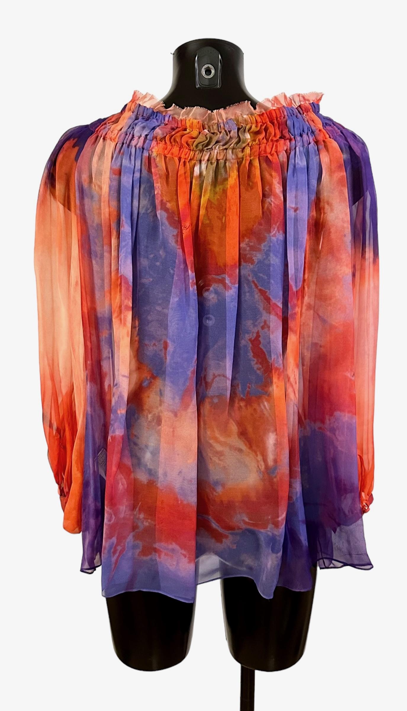This pre-owned Emilio Pucci colorful silk mousseline blouse is in perfect condition. 
Part of the SS 2015 collection that was greatly inspired by the 70's !!!
Can be worn off the shoulders as well as on !
Bohemian style for a great summer look