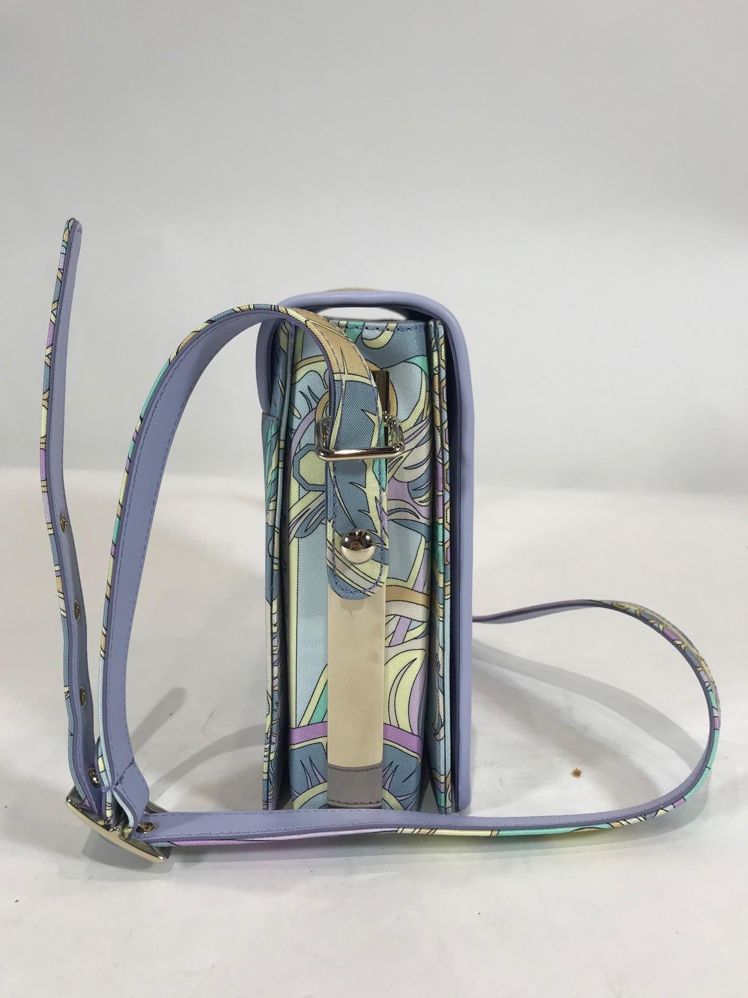 Multicolored pastel silk with classic Pucci abstract pattern. Silver-tone hardware. Front flap closure with magnetic closure. Adjustable shoulder strap. One main interior pocket featuring two slit compartments. One interior slip pocket in main