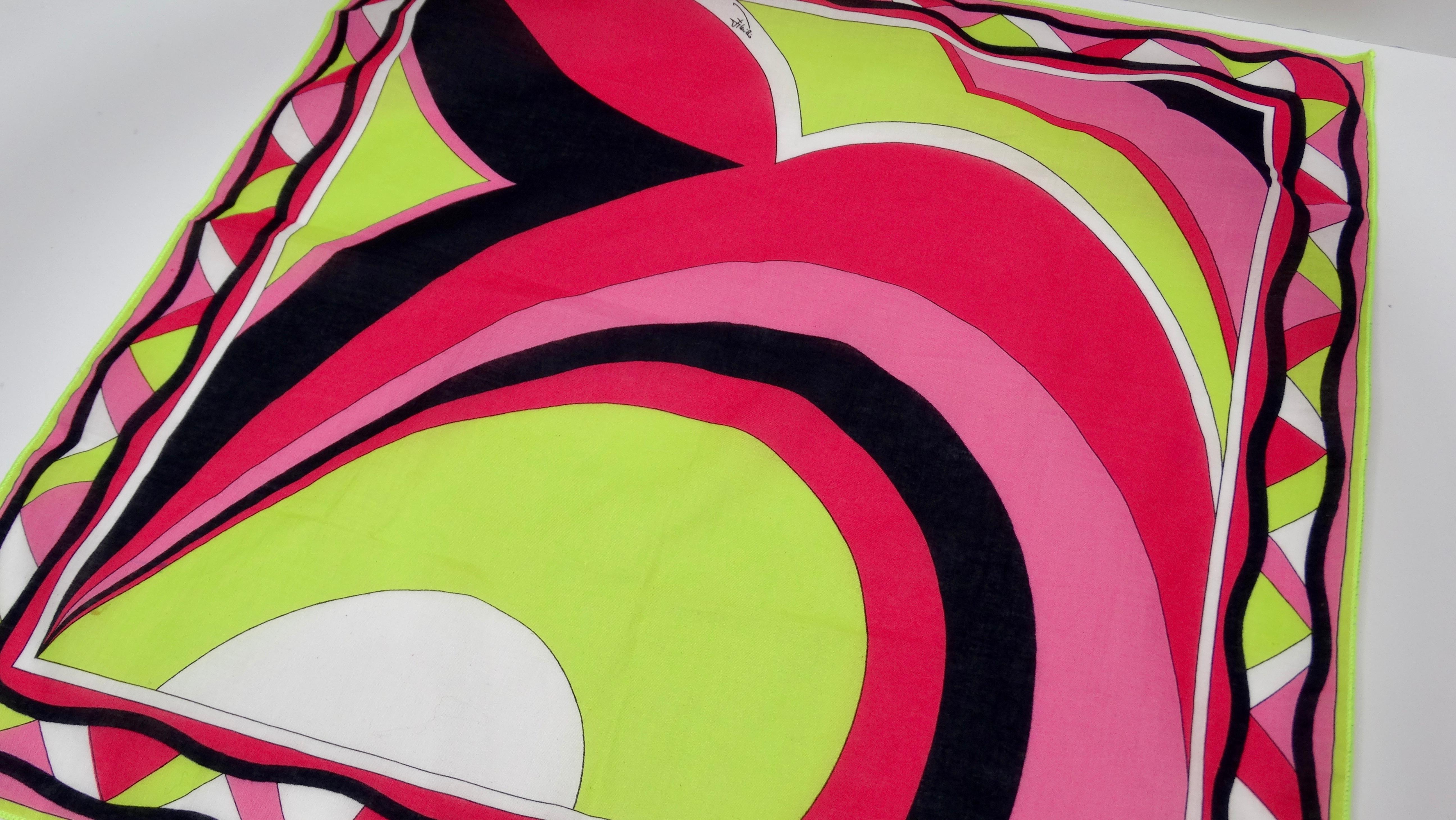 Add this Pucci to your collection! Circa 1960s, this adorable cotton scarf features one of Pucci's signature abstract geometric designs with vibrant colors of contrasting pinks, lime green and black. Geometric trim along the boarder. Emilio Pucci