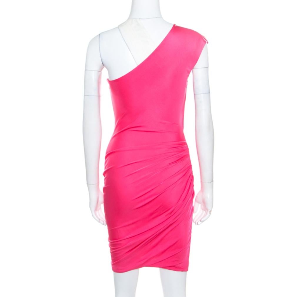 This one shoulder dress from Emilio Pucci promises to make you look nothing less than a diva! The pink creation is made of 100% viscose and features a flattering feminine silhouette. It flaunts a draped layout and can be paired well with platform