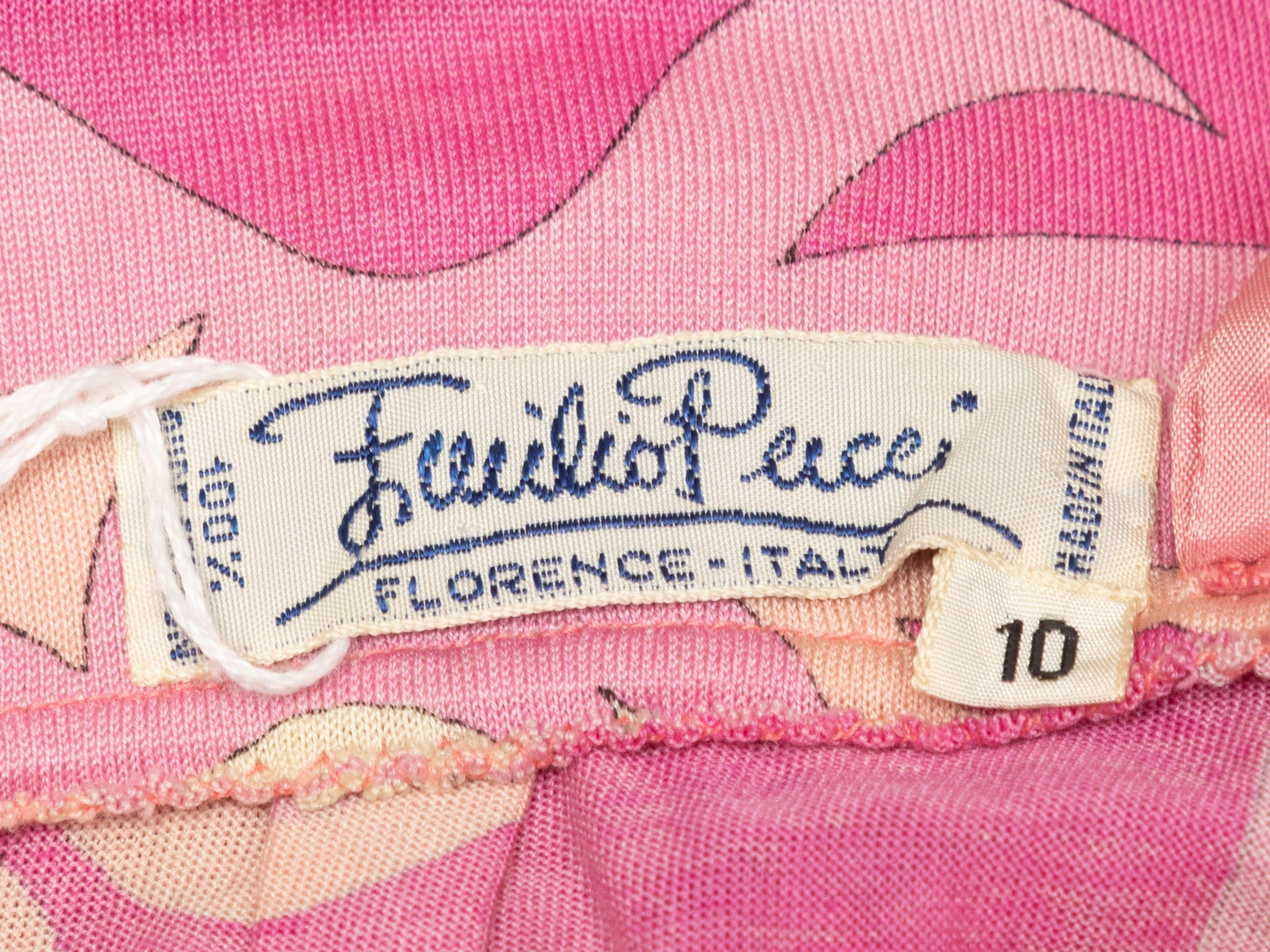 Product Details: Vintage pink and white abstraact print pleated skirt by Emilio Pucci. Circa 1960s. Side closure. Designer size 10. 28