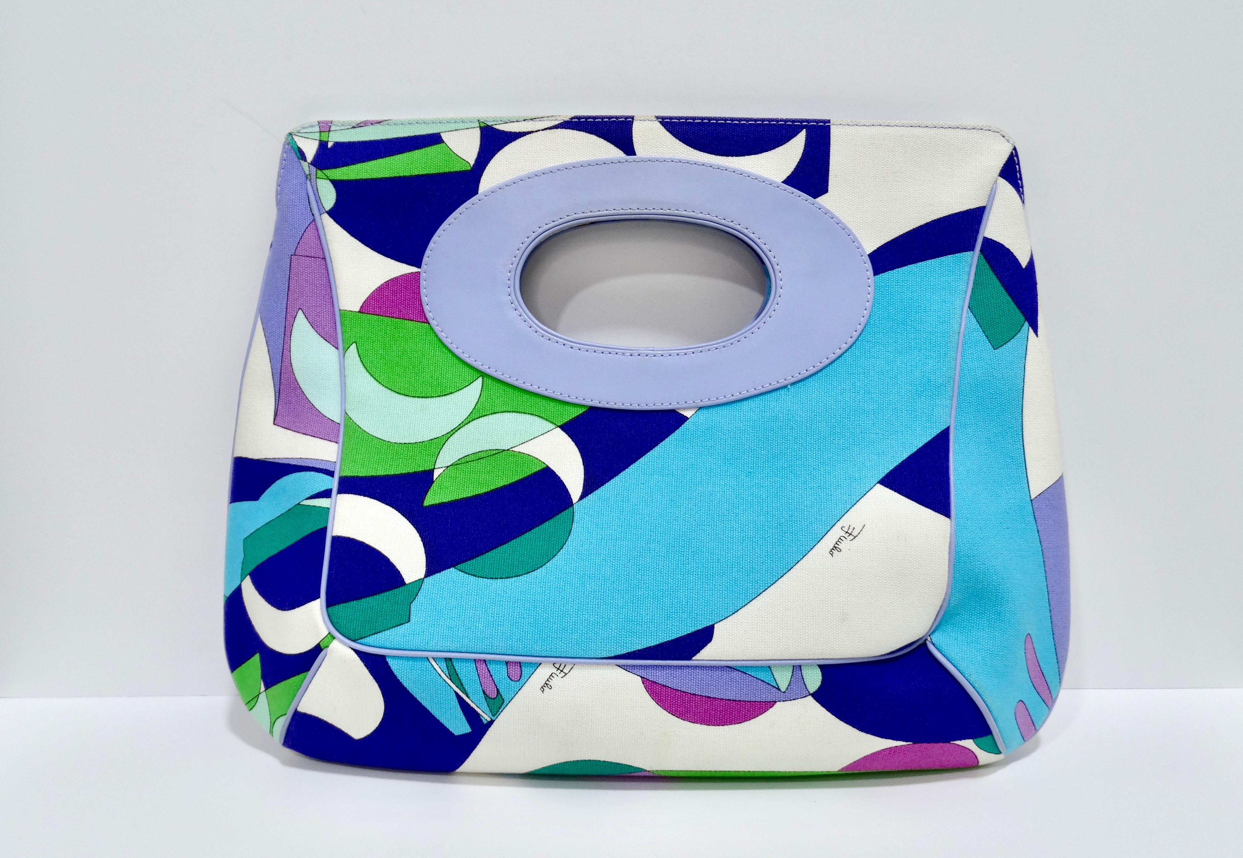 Summer is coming and you need to add a printed Pucci to your collection. Emilio Pucci is known for his fluid shapes, kaleidoscopic motifs, and bright colors. This features a leather handle, large monogramed interior, canvas fabric, and a groovy