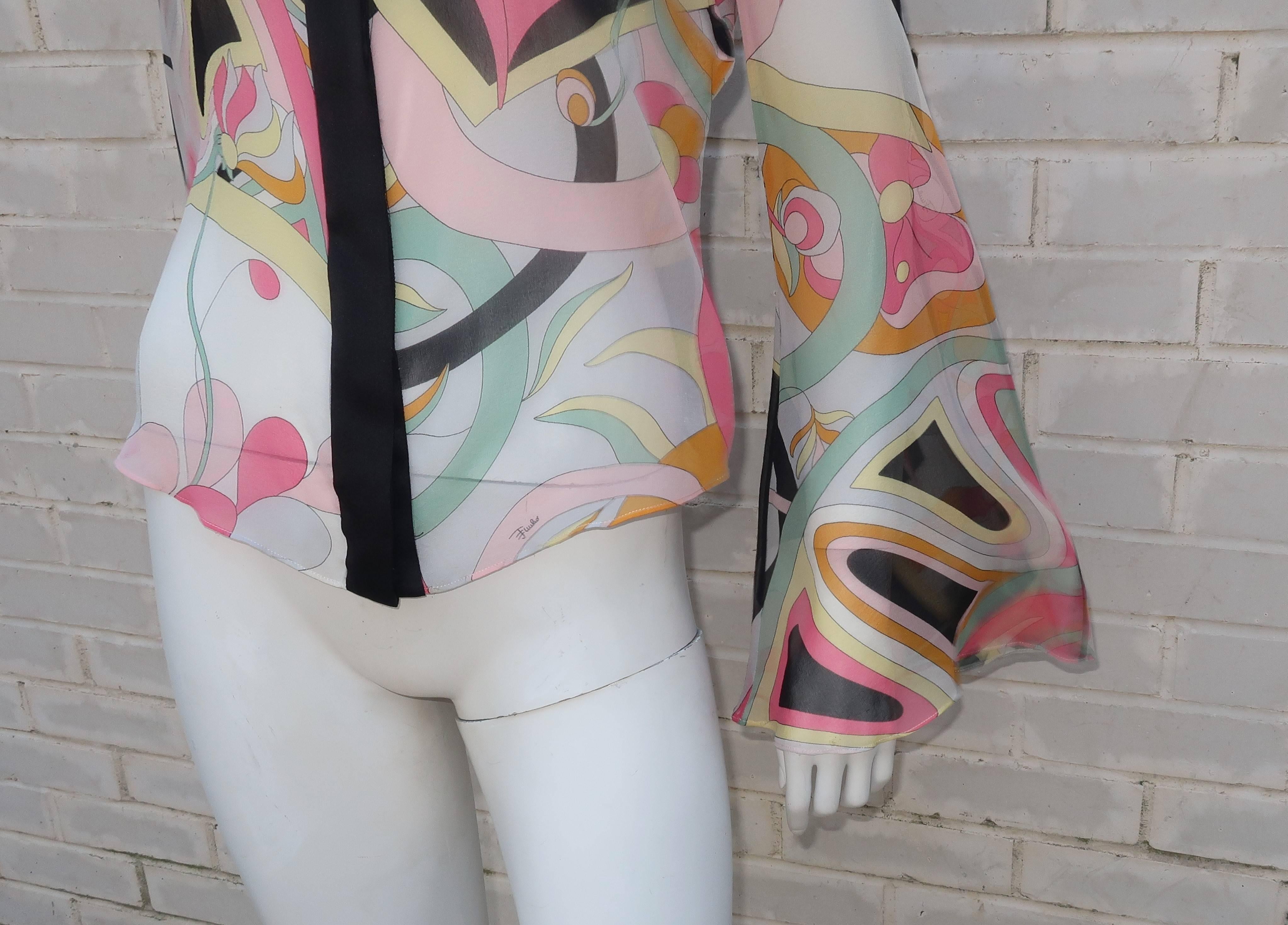 Emilio Pucci, the king of psychedelic prints, produced this silk chiffon blouse C.2000 with a definitive nod to the mod rock & roll era fashions of the 1960's and 1970's.  The blouse has hidden buttons at the front with black charmeuse collar and