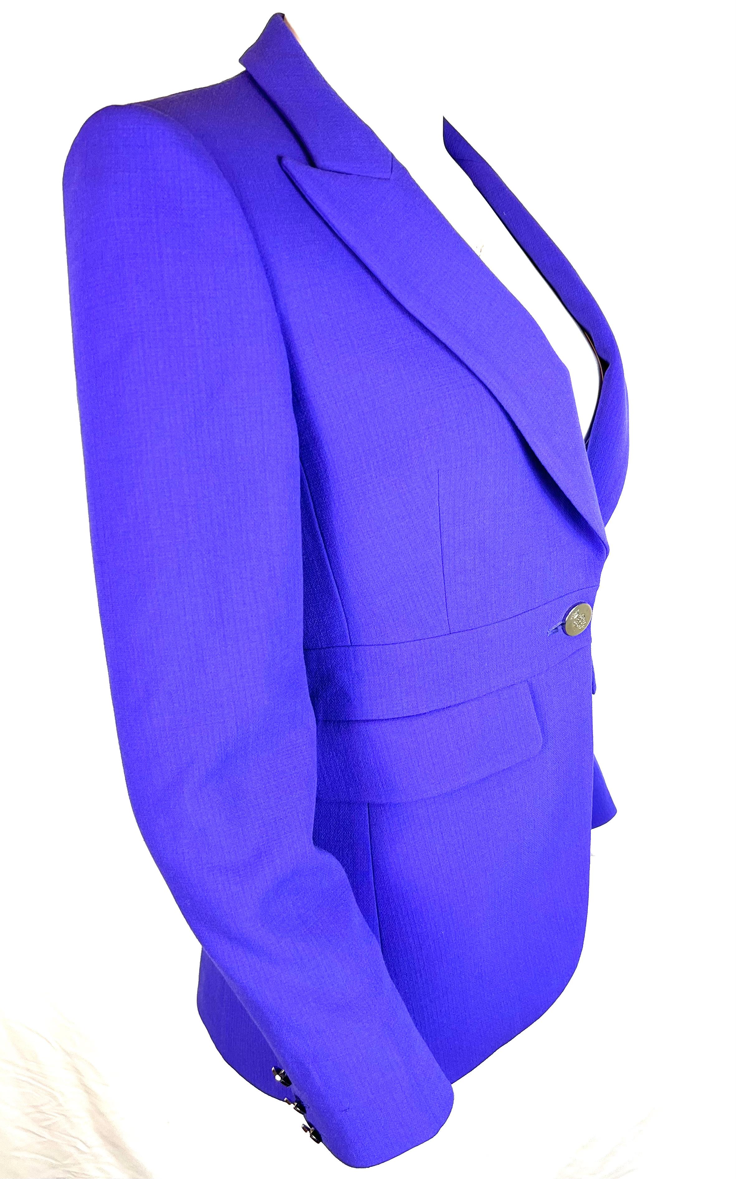 Emilio Pucci Purple Blazer Jacket, Size 8

- Deep v- neck line
- Collar
- Front button closure
- Side pockets
- Buttons detail on the sleeves
- Silver tone hardware

