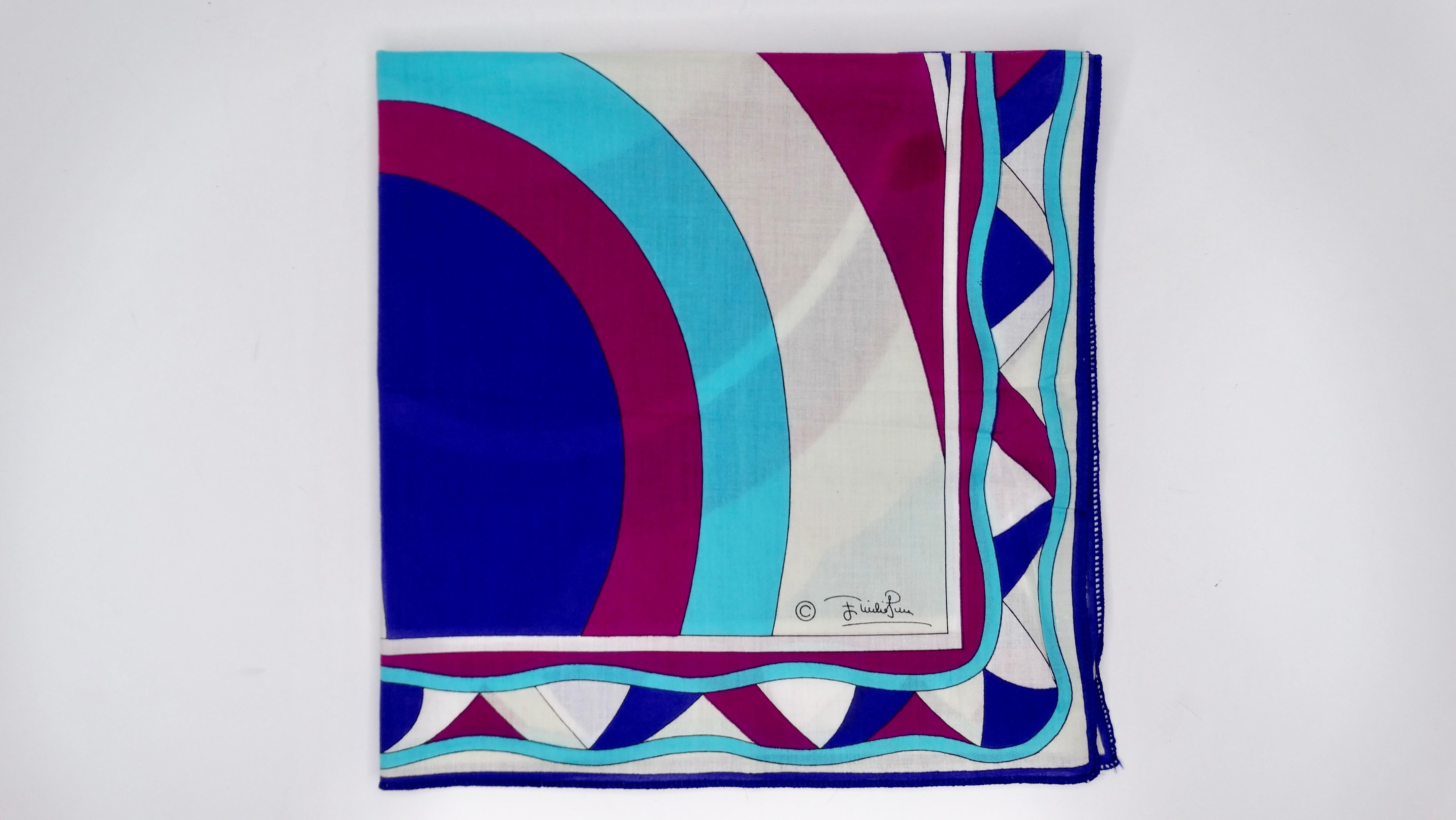 Add this Pucci to your collection! Circa 1960s, this adorable cotton scarf features one of Pucci's signature abstract geometric designs with shades of purple, pink, white and blue. Emilio Pucci written throughout, made in Italy. This piece is