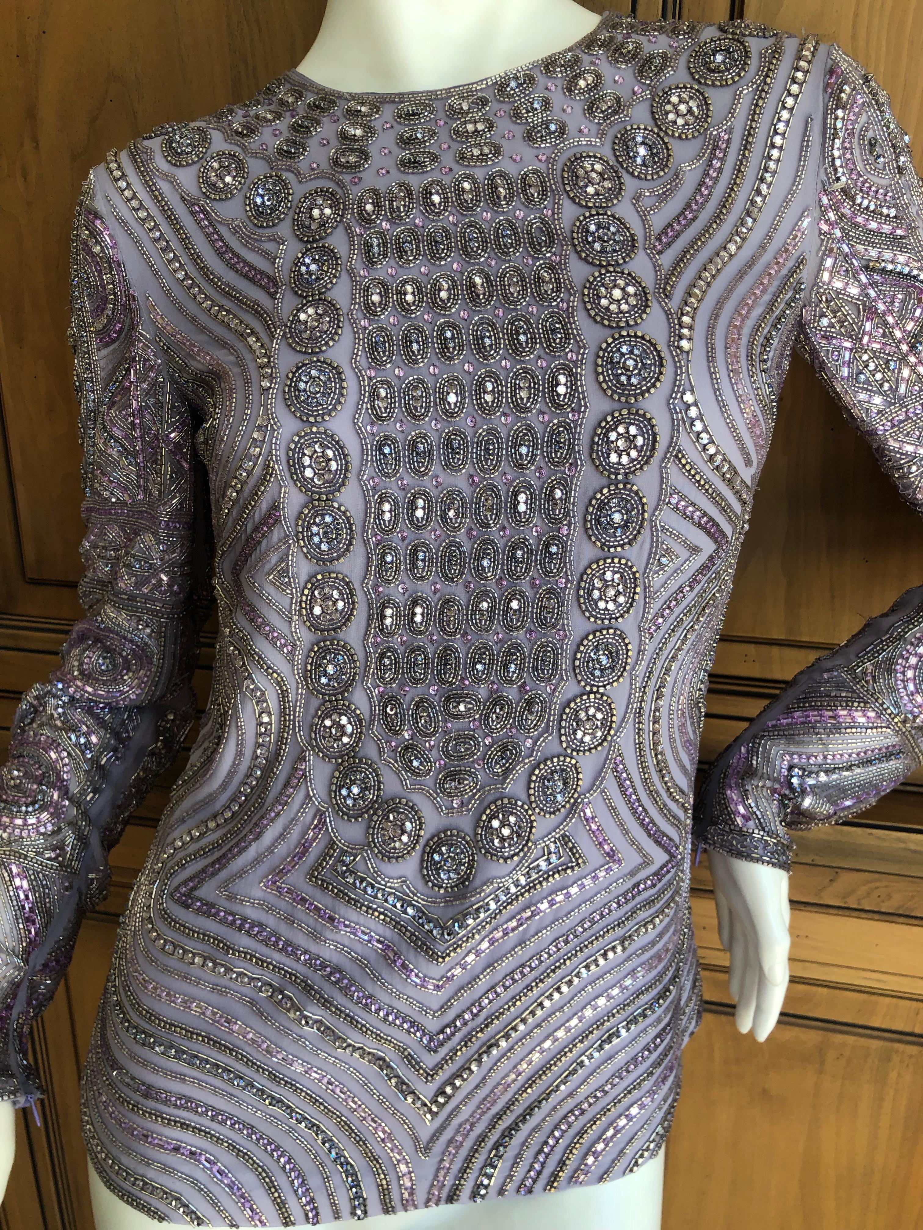 Emilio Pucci Remarkable Silk Bead and Crystal Embellished Top
This still has the store tags attached, the retail was $3260 USD
WOW 
Rare to see a completely embellished Pucci top, this is unreal.
The beads are glass, and this is quite heavy.
Size