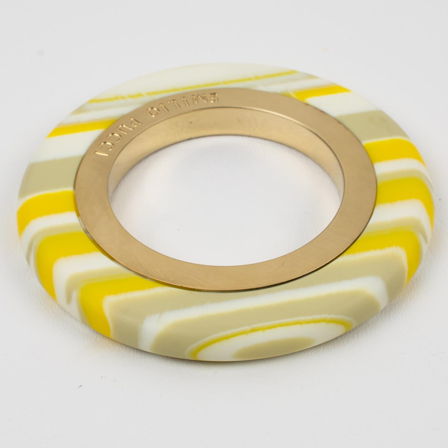 Stunning oversized Emilio Pucci resin and gilt metal bracelet bangle. Chunky bold flat shape with laminated-design builds with satin gilt metal inner band contrasted with yellow, gray, and white multi-layers resin outer band. Emilio Pucci's hallmark