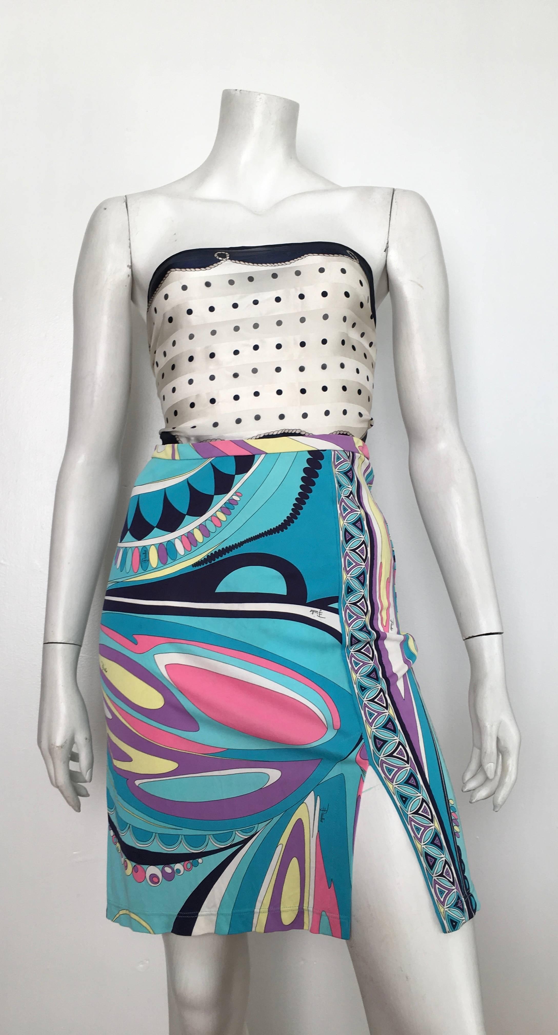 Emilio Pucci very sexy form fitting skirt with elastic waist band is a size 4. Whimsical and iconic Pucci print is timeless and classic.  Wear this skirt with your favorite vintage Hermes, Chanel or Bill Blass scarf as shown in photo tied in the