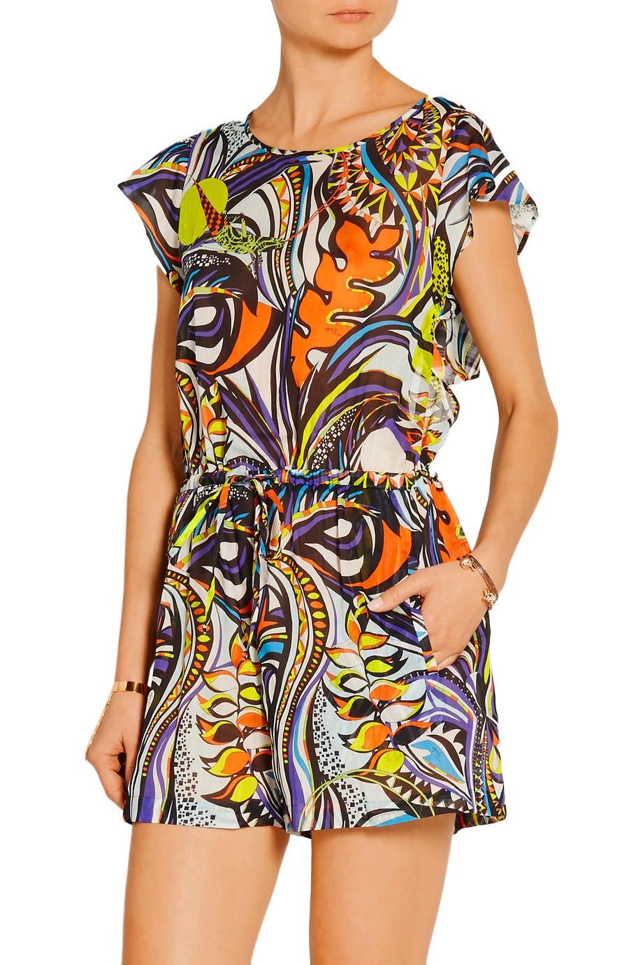 Emilio Pucci's playsuit is decorated with the label's tropical print in bright orange, purple and chartreuse hues. It's crafted from lightweight cotton-voile and has a fluttering cape-effect overlay at the open back. Use the drawstring to cinch the