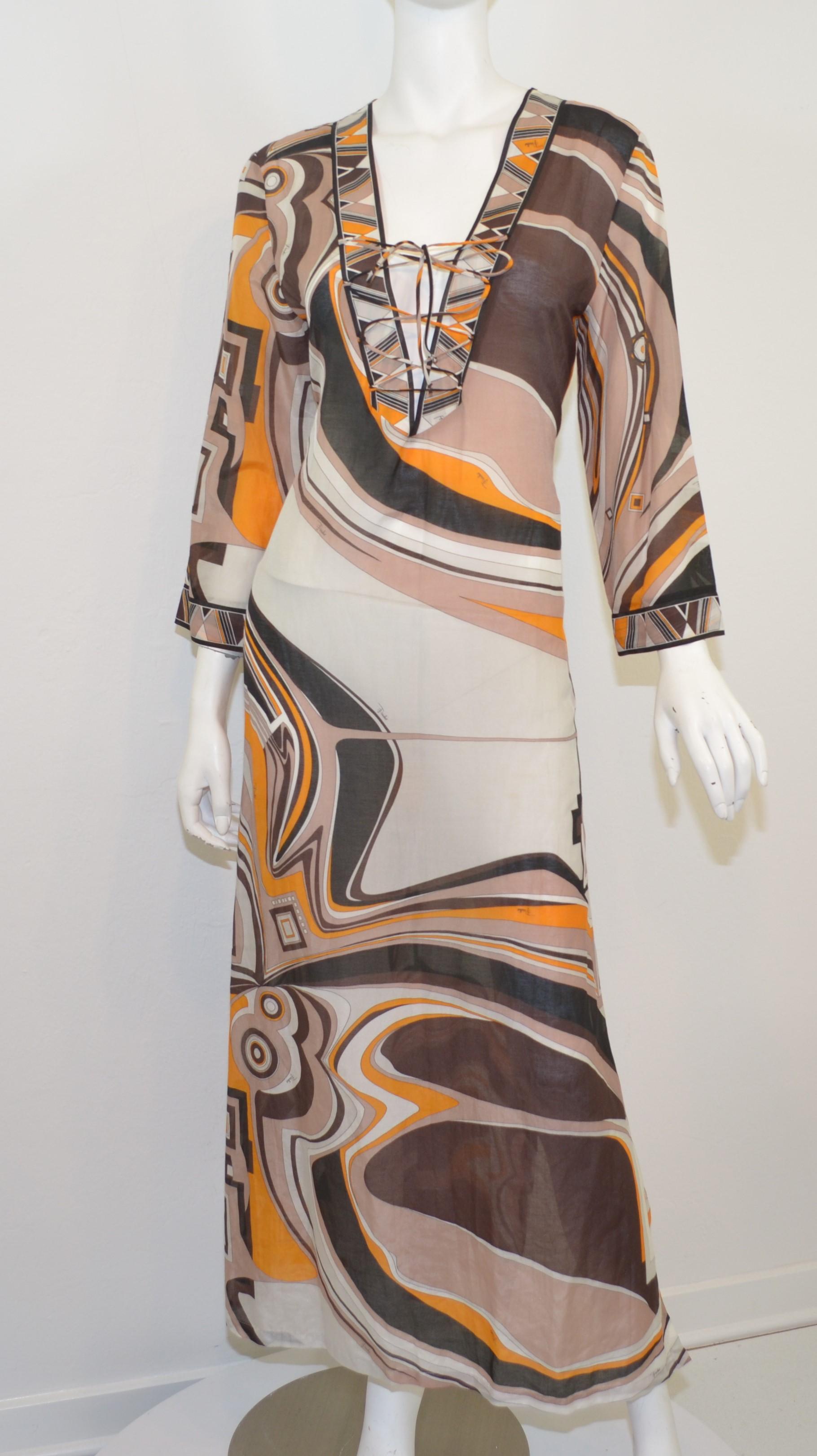 Emilio Pucci dress featured in a brown/tan print with a lace-up tie closure. Dress is a size 40 and composed with a cotton and silk blend. Excellent pre-owned condition. Made in Italy.

Measurements:
Bust 38''
Waist 38''
Hips 44''
Sleeves